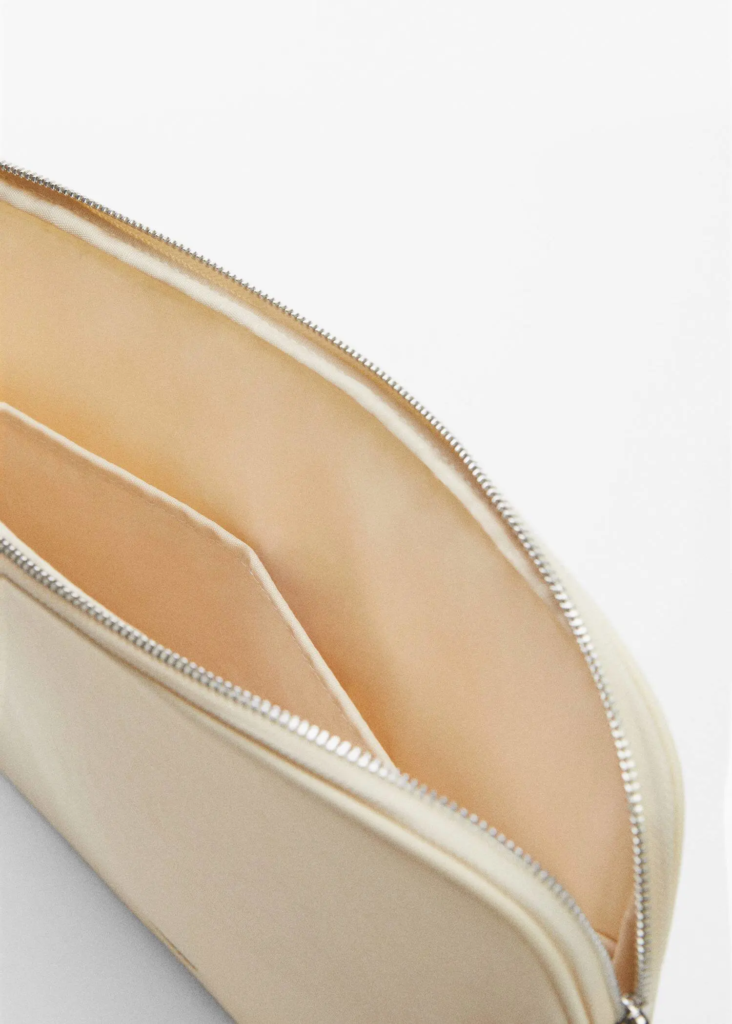 Mango Double-compartment laptop case. a close-up view of the inside of a purse. 