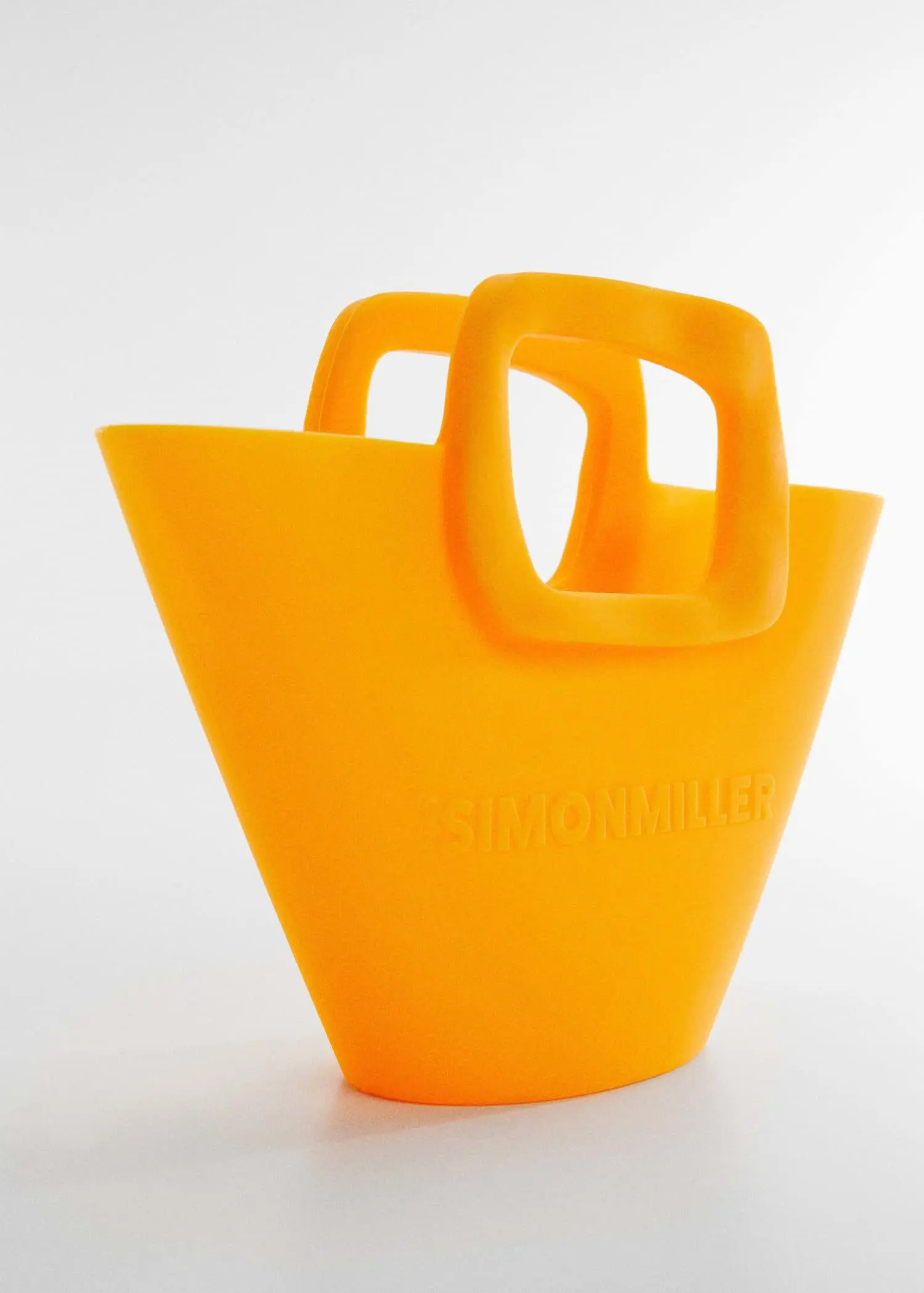 Mango Mini-bag with geometric logo . an orange bag with handles on a white surface. 