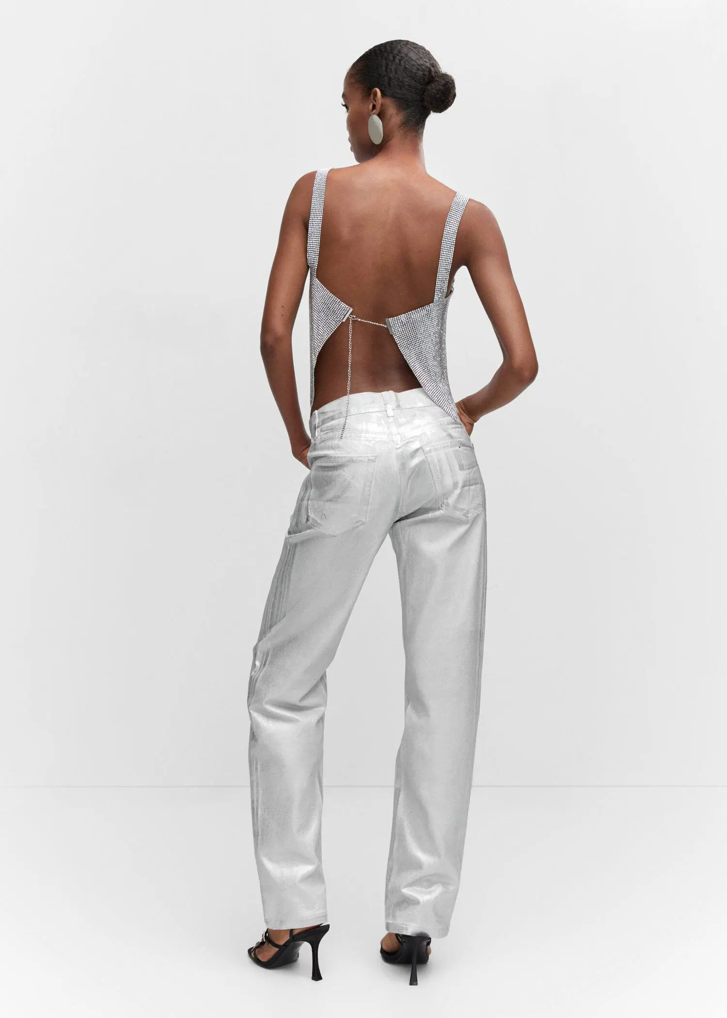 Mango Crystal mesh top. a woman wearing white pants and a white tank top. 