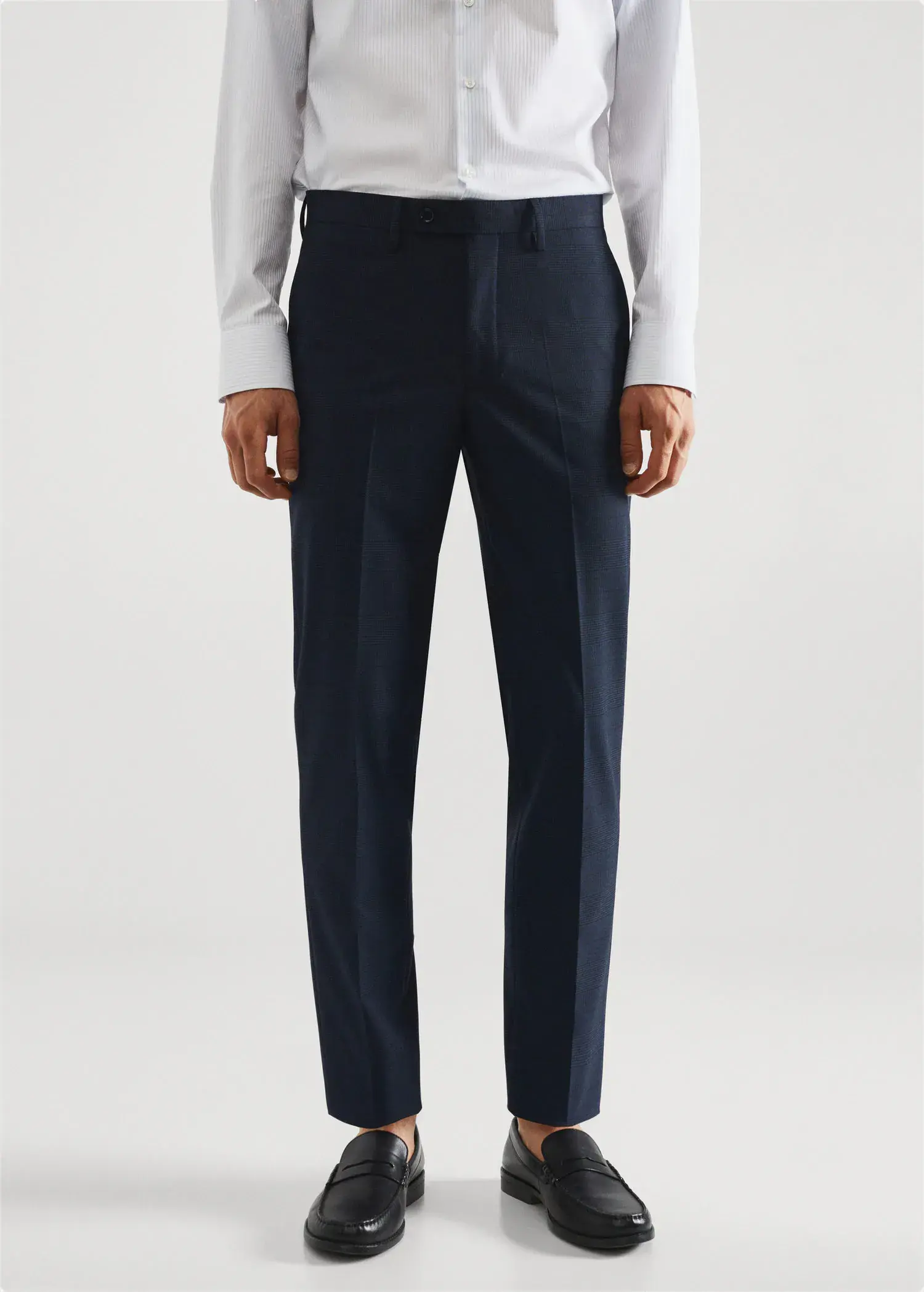 Mango Stretch fabric slim-fit printed suit trousers. a man wearing a suit standing in front of a white wall. 