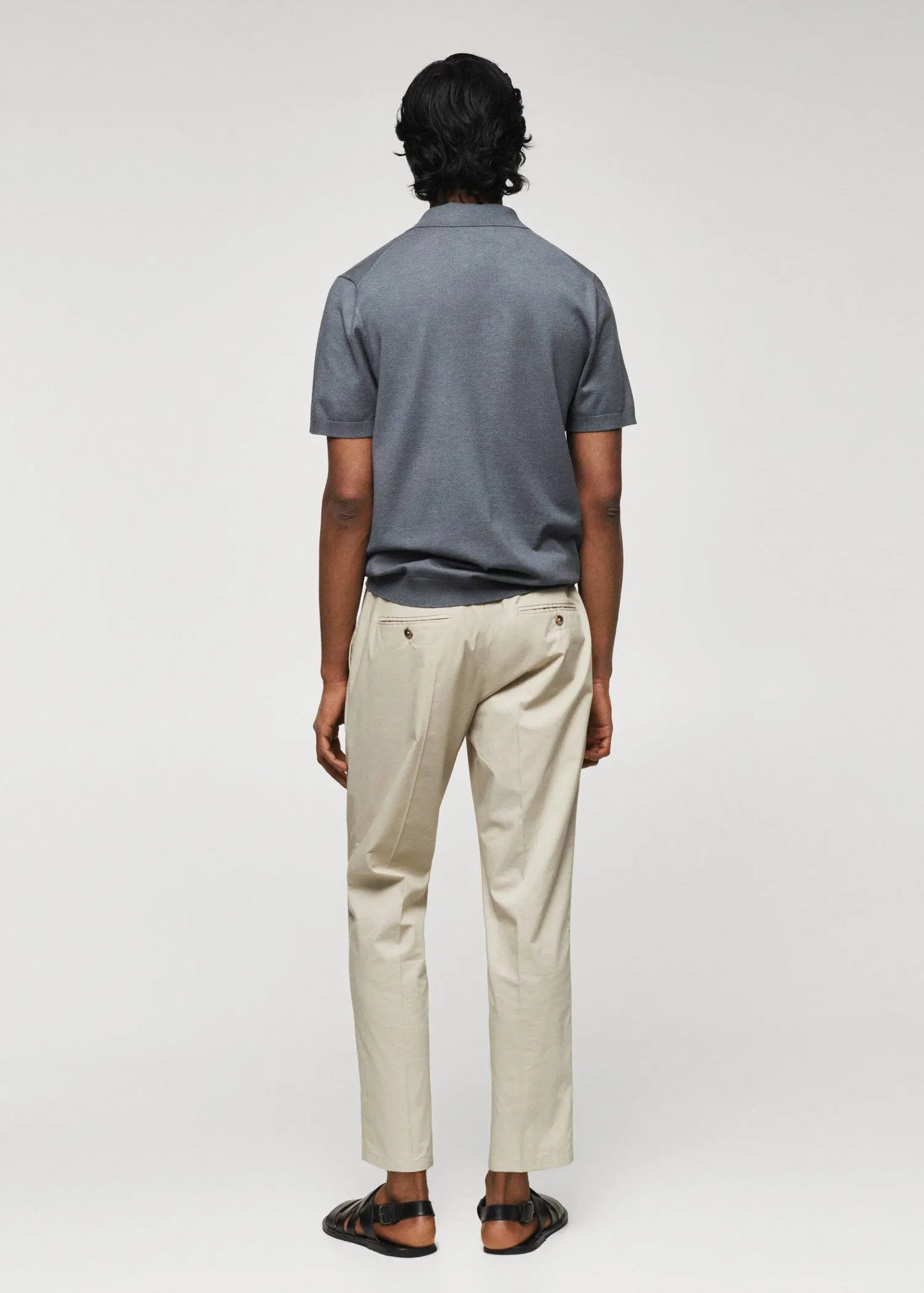 Mango Fine-knit polo shirt. a man in a gray shirt and beige pants. 