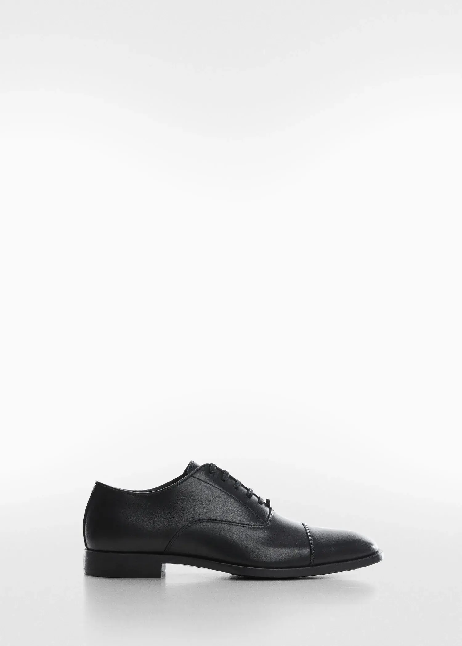 Mango Elongated leather suit shoes. a pair of black shoes on a white background. 