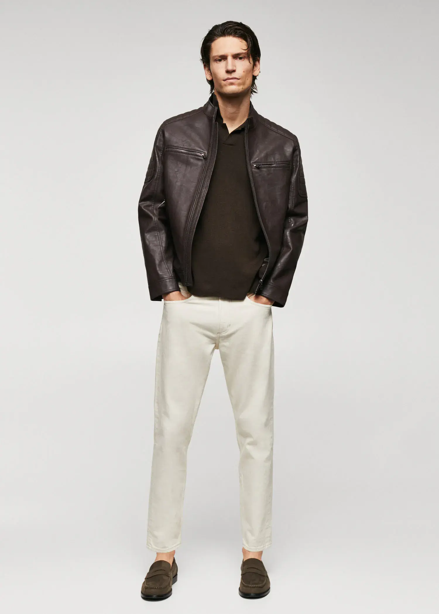 Mango Nappa leather-effect jacket. a man wearing a brown jacket and white pants. 