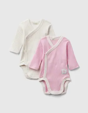 two long sleeve ribbed knit bodysuits