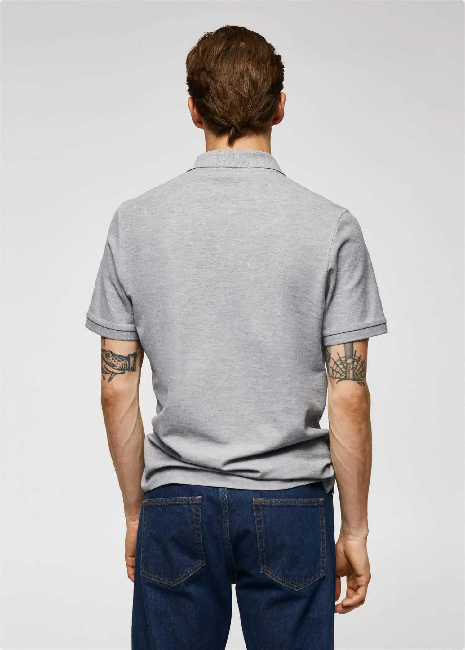 Mango 100% cotton pique polo shirt. a man wearing jeans and a gray shirt. 