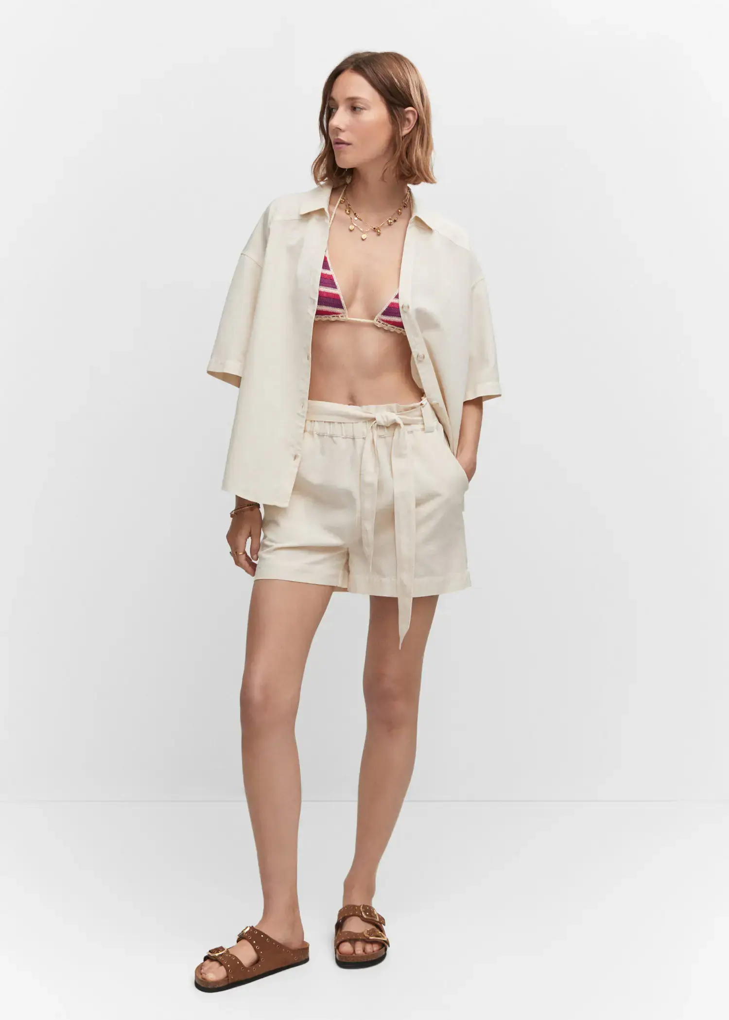 Mango Cotton linen-blend shirt. a woman in a white bikini top and shorts. 
