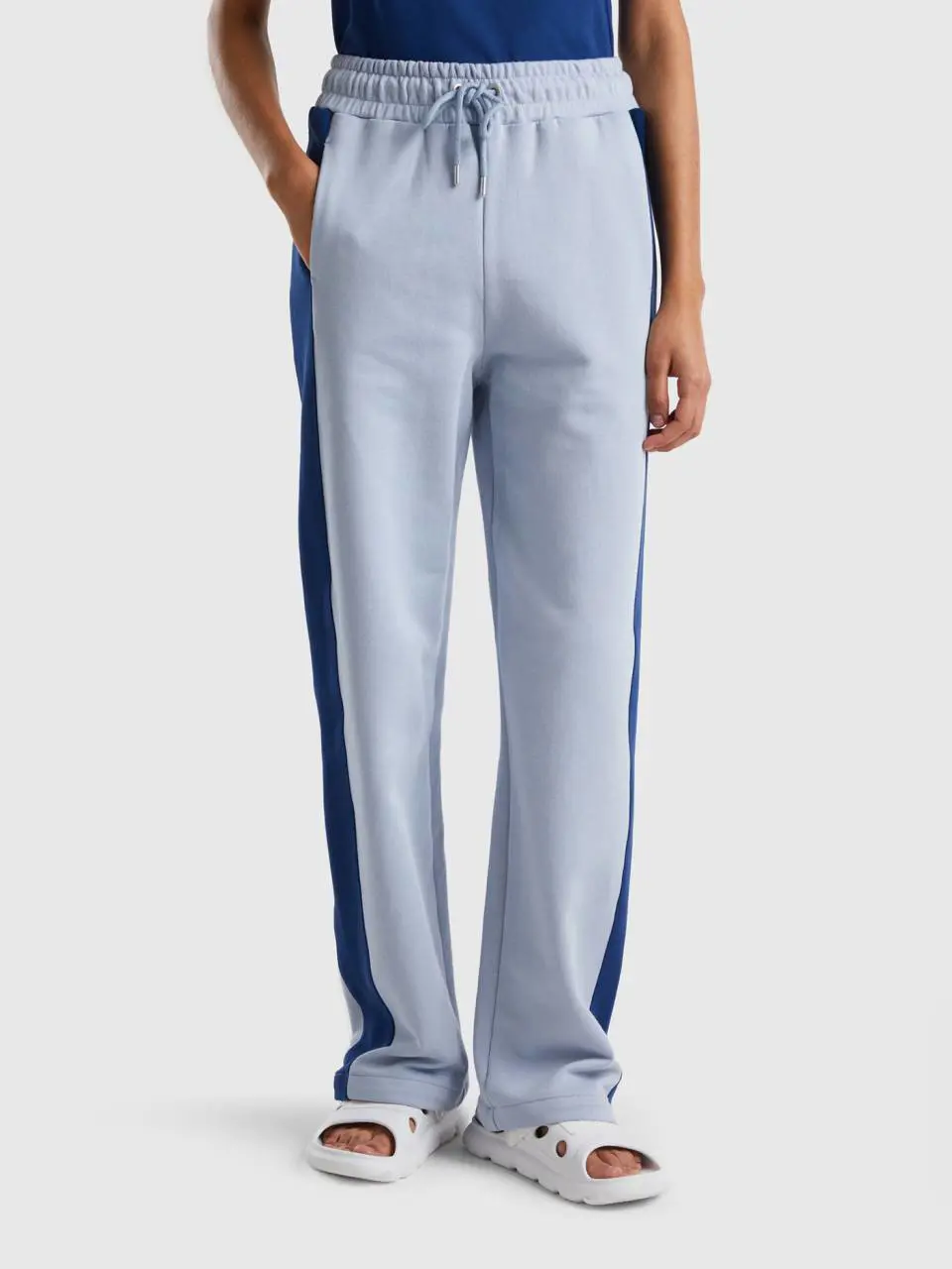 Benetton sky blue trousers with dark blue band. 1