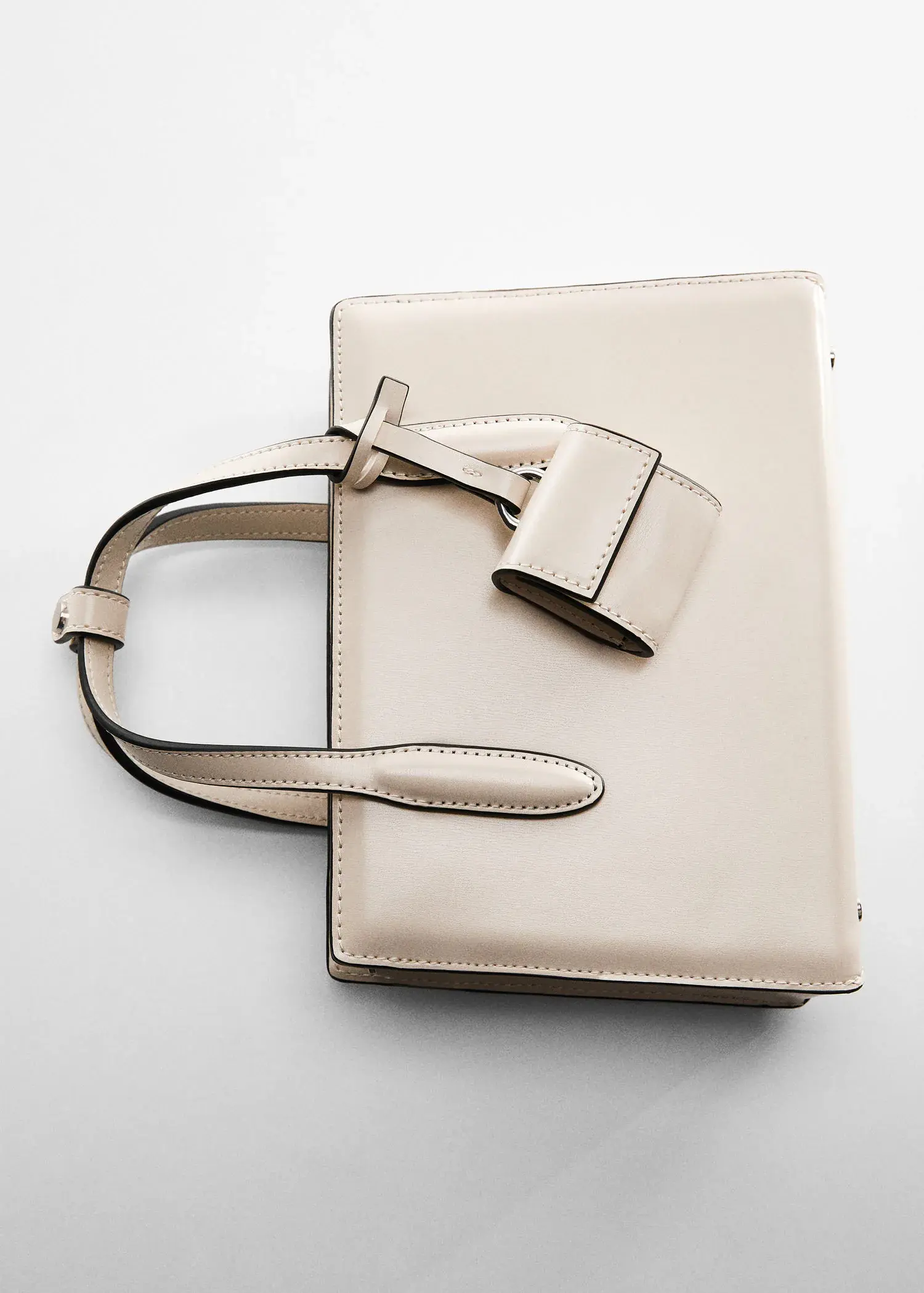 Mango Saffiano-effect small shopper bag. a white purse sitting on top of a white table. 