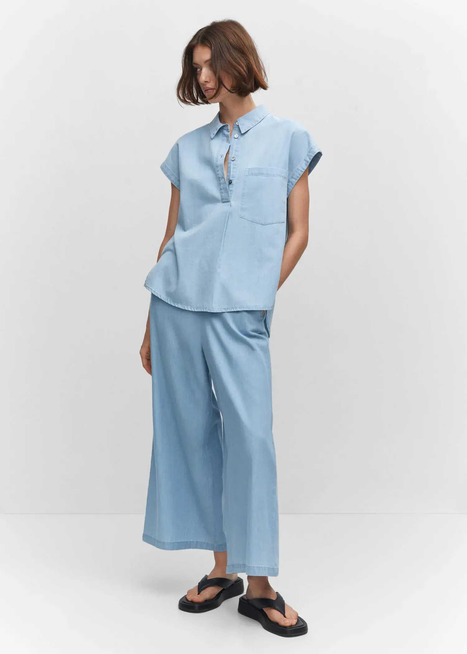 Mango 100% cotton culotte trousers . a person standing in a room wearing a blue outfit. 