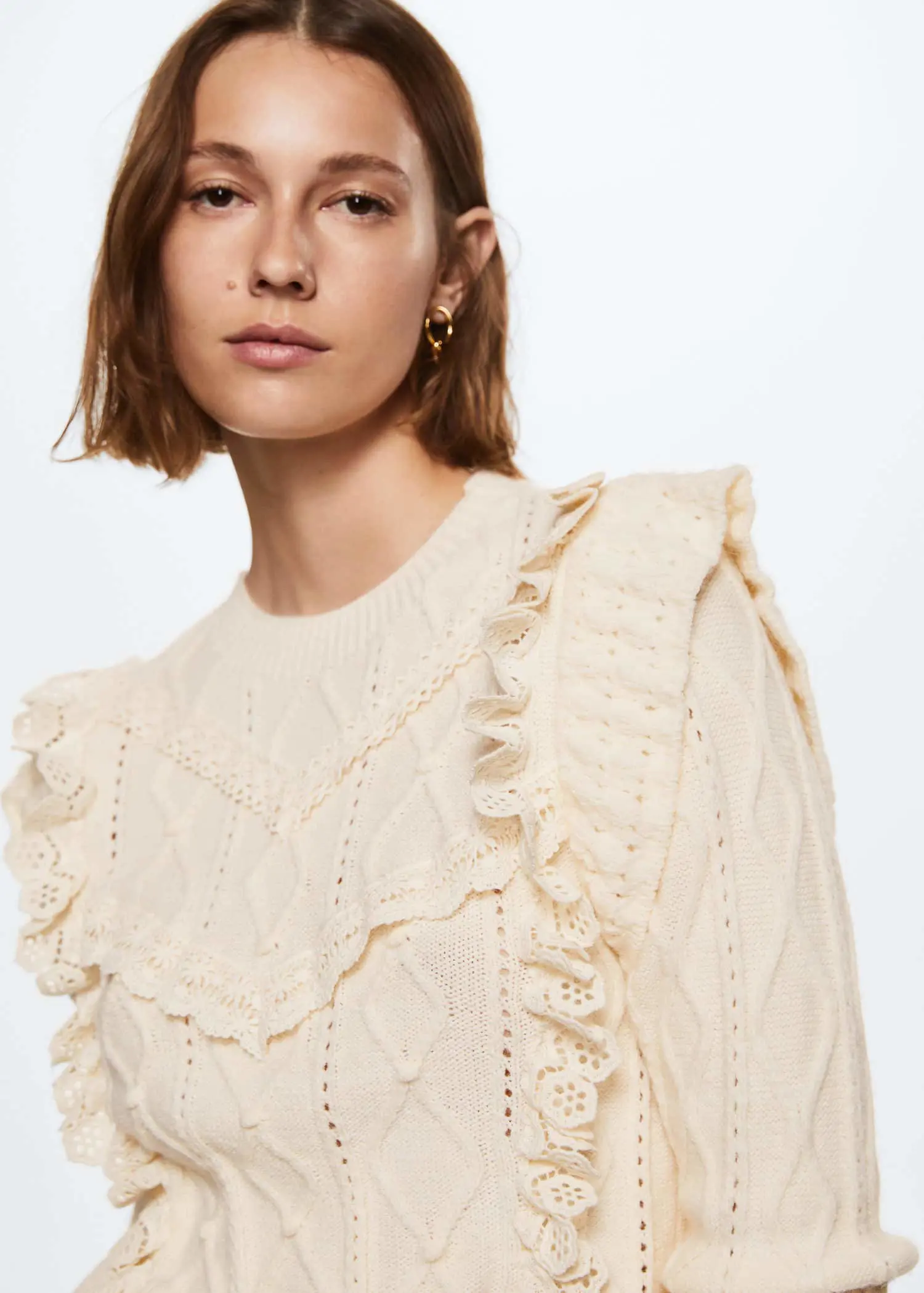 Mango Frilled openwork sweater. a close up of a person with short hair 