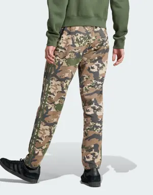 Adidas Pantalon de survêtement graphique à motif camouflage. 2 Adidas Pantalon de survêtement graphique à motif camouflage. 2