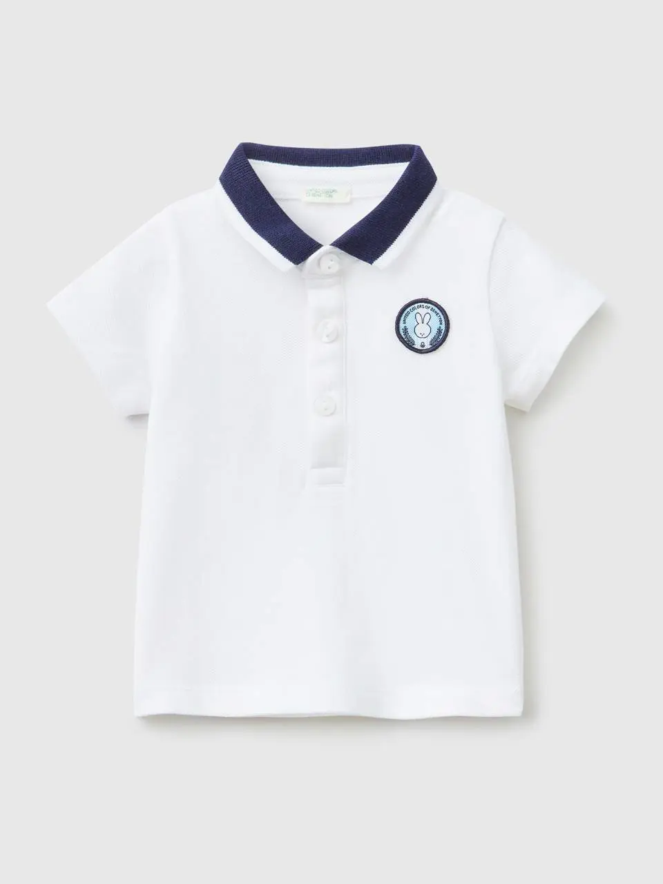 Benetton short sleeve polo with patch. 1