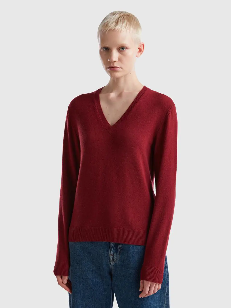 Benetton burgundy v-neck sweater in pure merino wool. 1