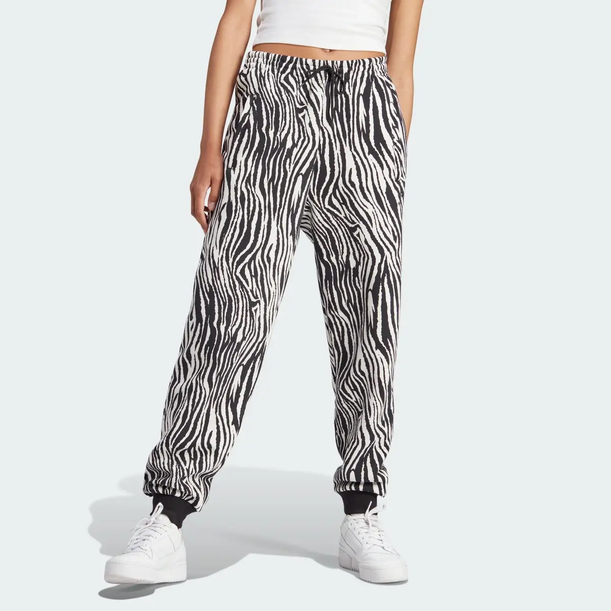 Adidas Pantaloni Allover Zebra Animal Print Essentials Joggers. 1