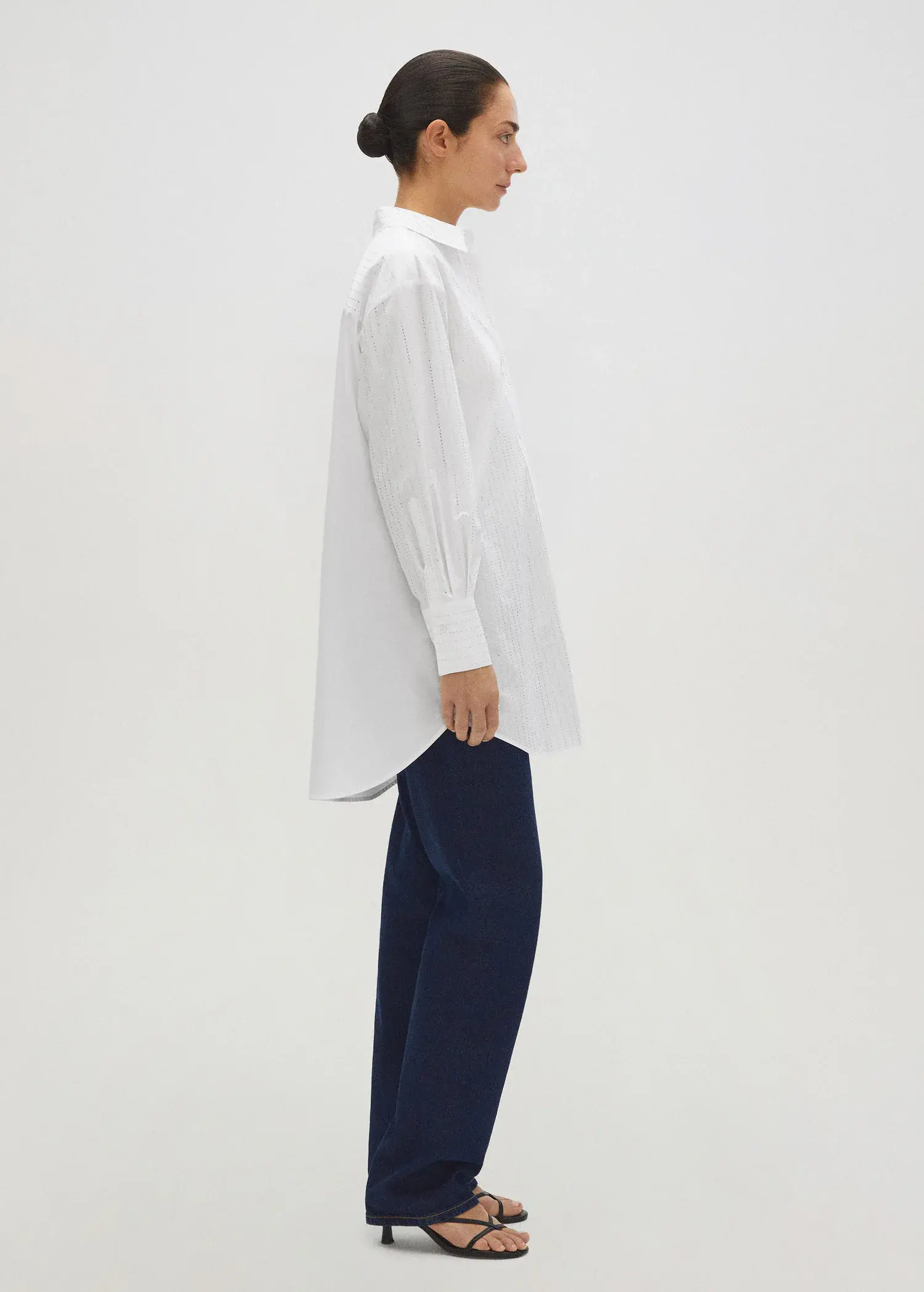 Mango Poplin strass shirt. a person standing in front of a white wall. 