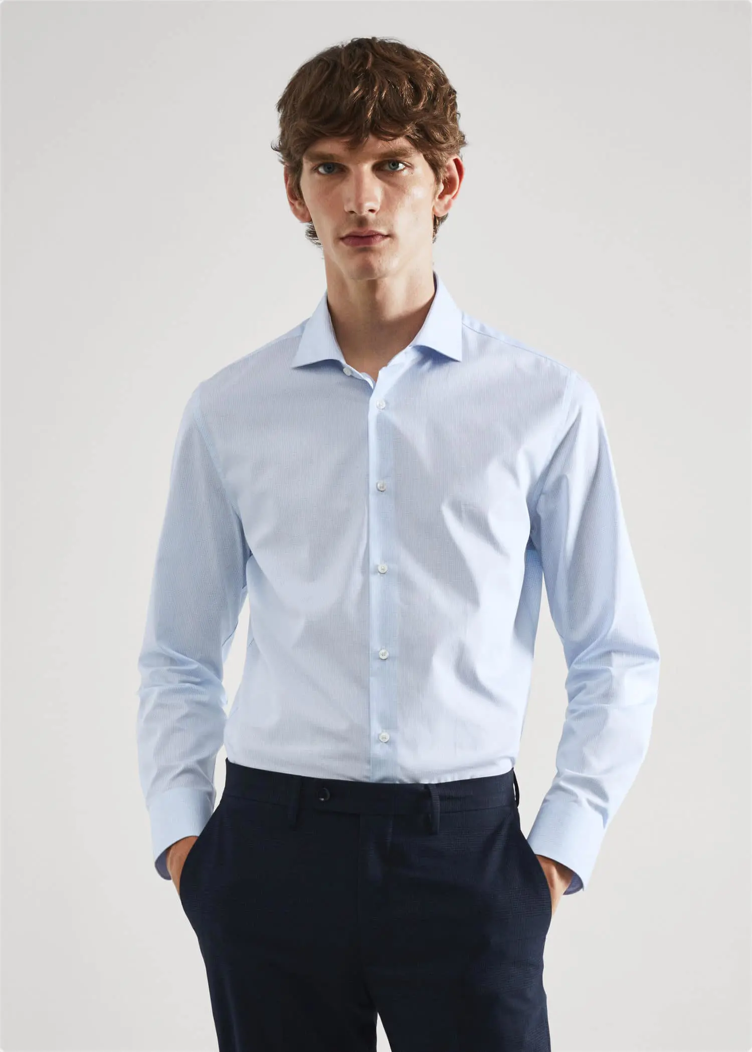 Mango Slim-fit micro-print twill suit shirt. a man wearing a light blue dress shirt. 