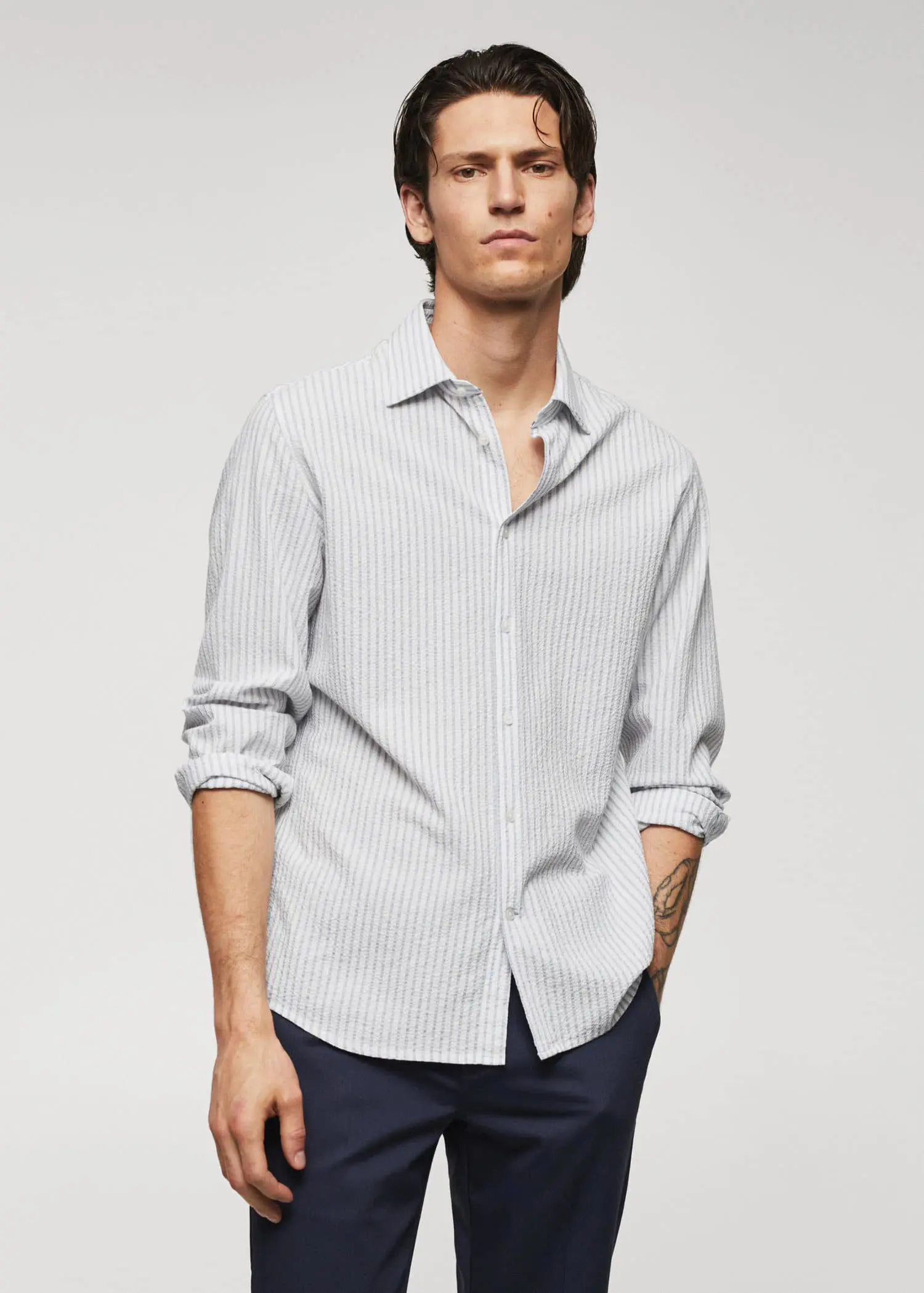Mango 100% cotton seersucker striped shirt. a man wearing a white and blue striped shirt. 