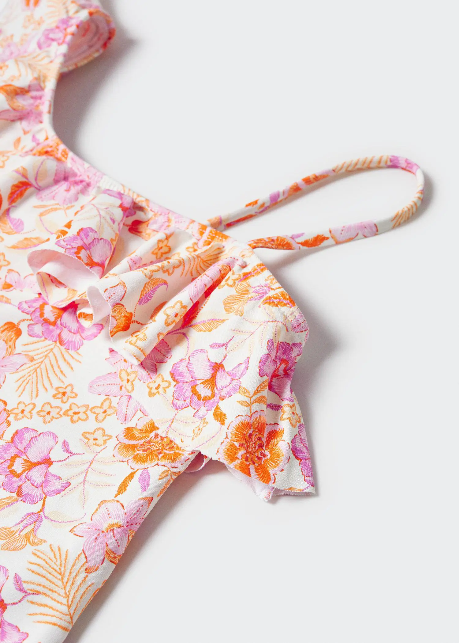 Mango Asymmetrical-print swimsuit. a close-up view of a pink and orange floral swimsuit. 