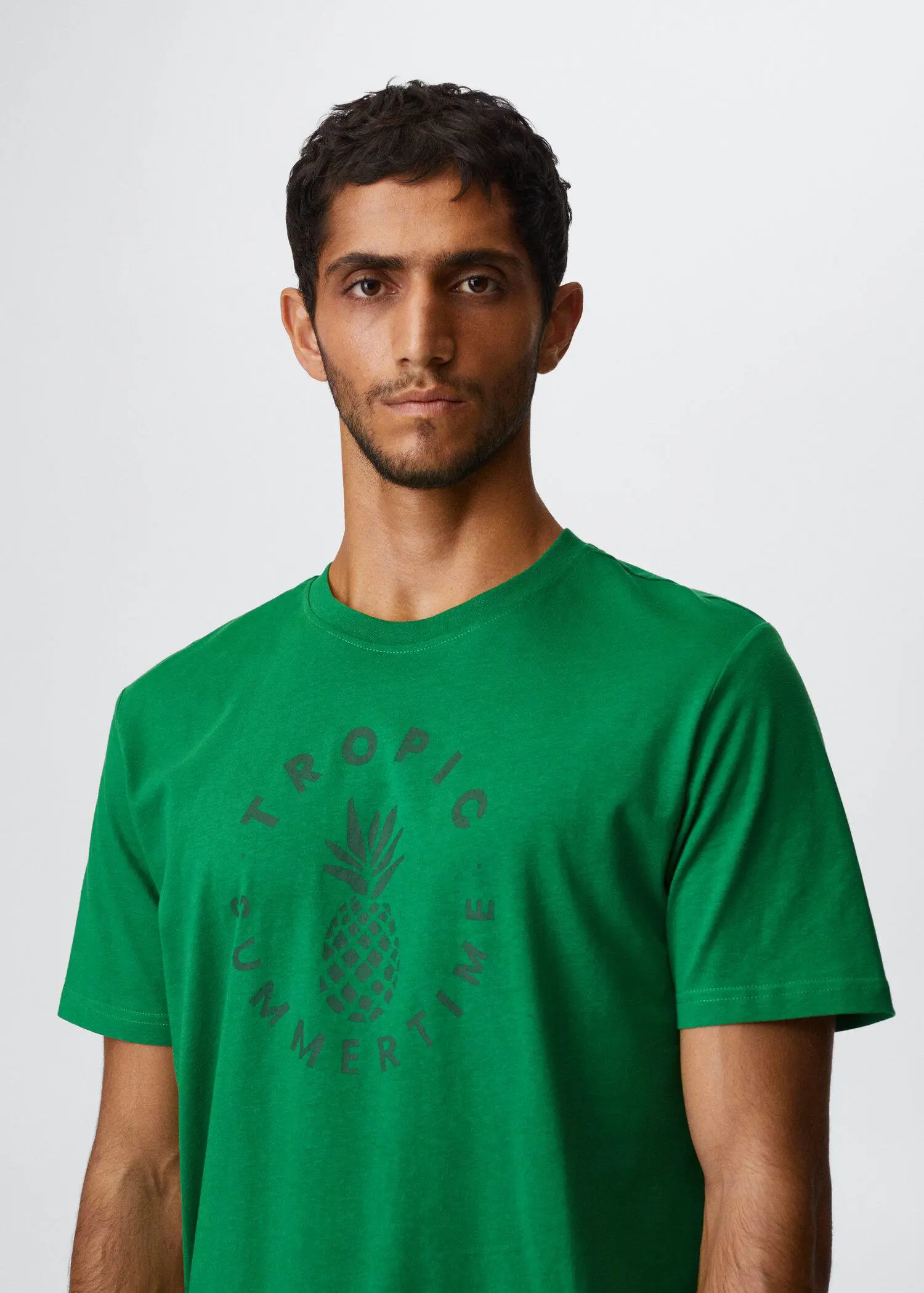 Mango Printed cotton-blend T-shirt. a man in a green shirt is posing. 