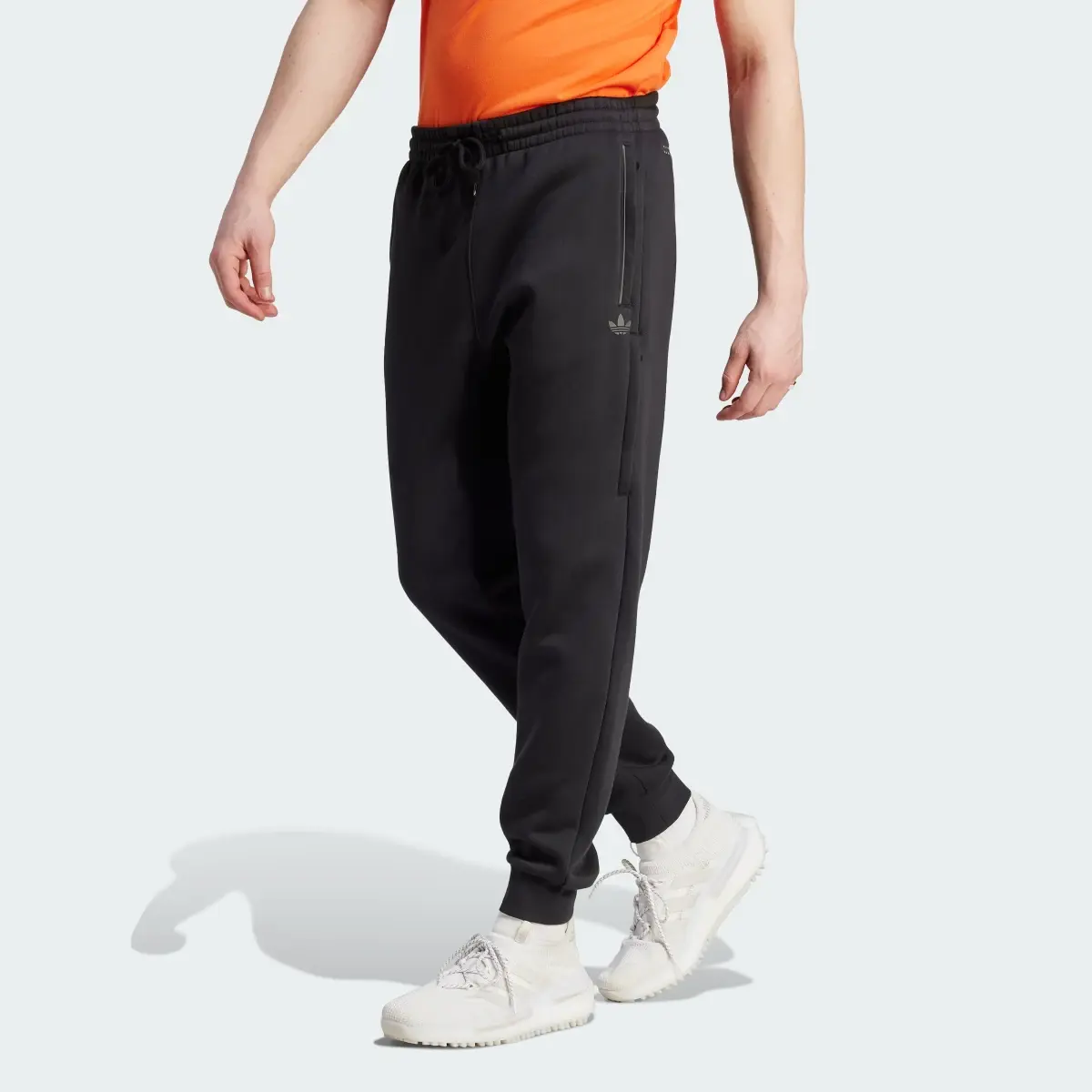 Adidas Spodnie dresowe Adicolor Seasonal Reflective. 1