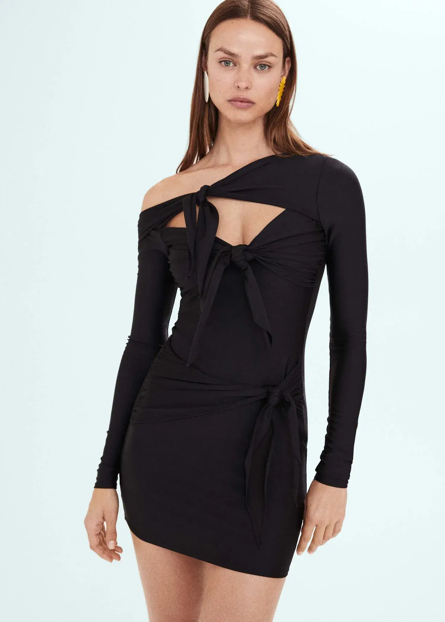 Mango Draped dress with knot detail. a woman in a black dress is posing for a picture. 