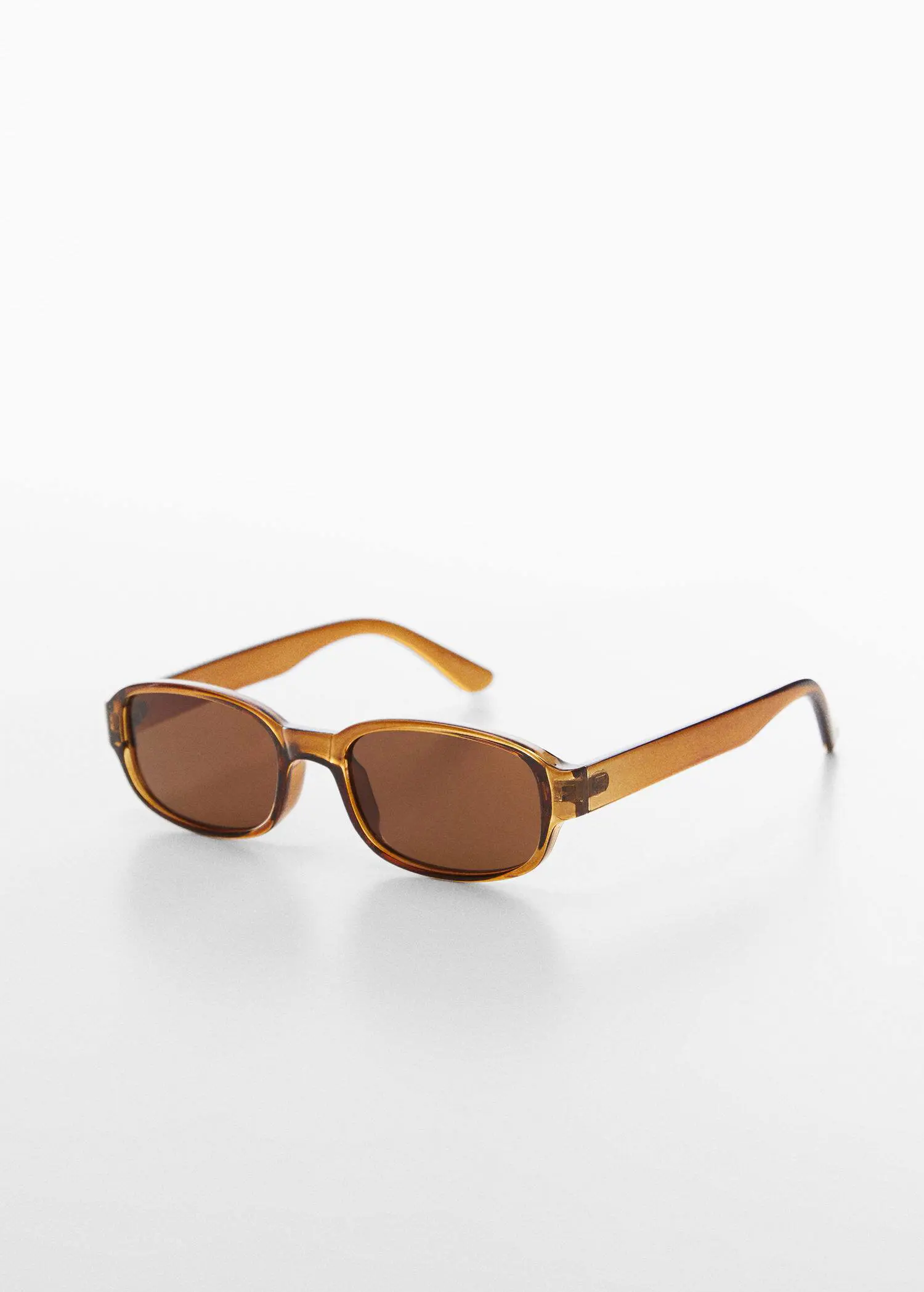 Mango Retro style sunglasses. a pair of brown sunglasses sitting on top of a table. 