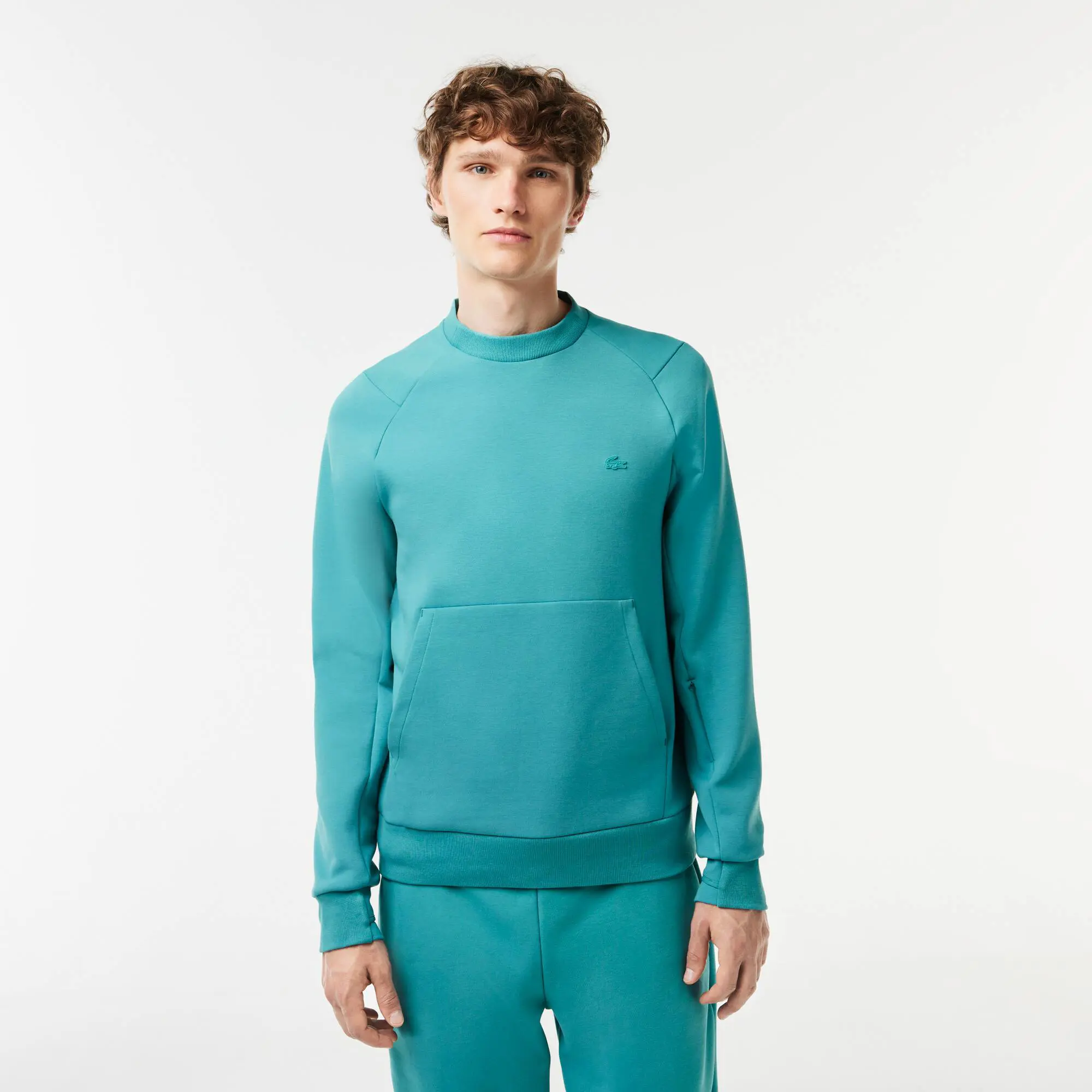 Lacoste Sudadera Jogger de hombre en mezcla de algodón con bolsillo tipo canguro y cuello redondo. 1