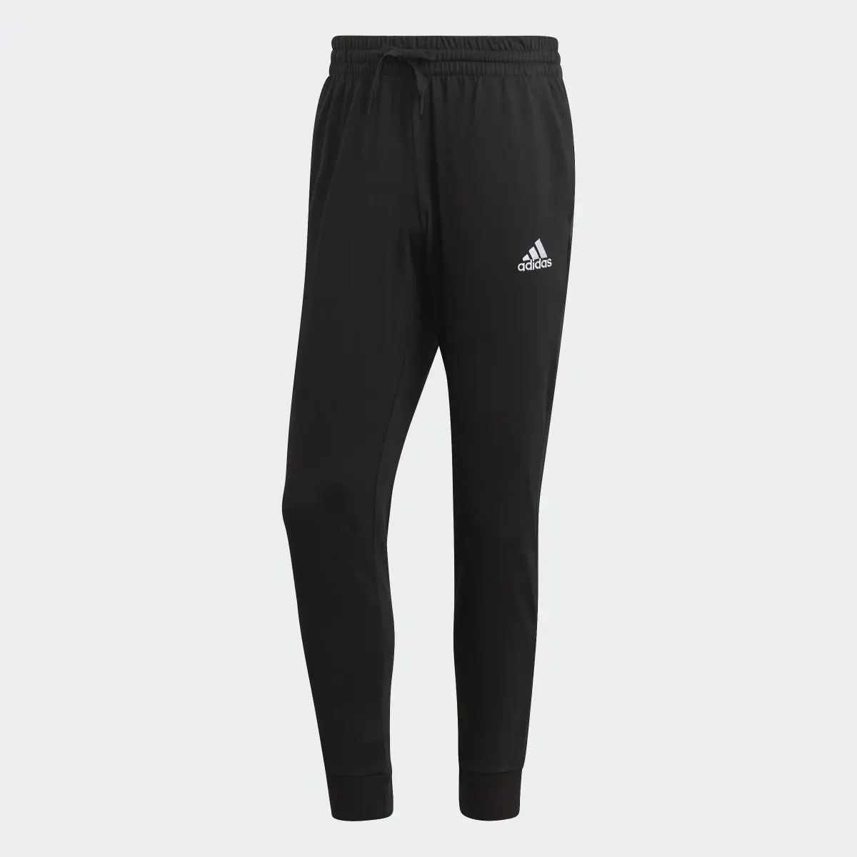 Adidas ESSENTIALS SINGLE JERSEY TAPERED CUFF Joggers. 1