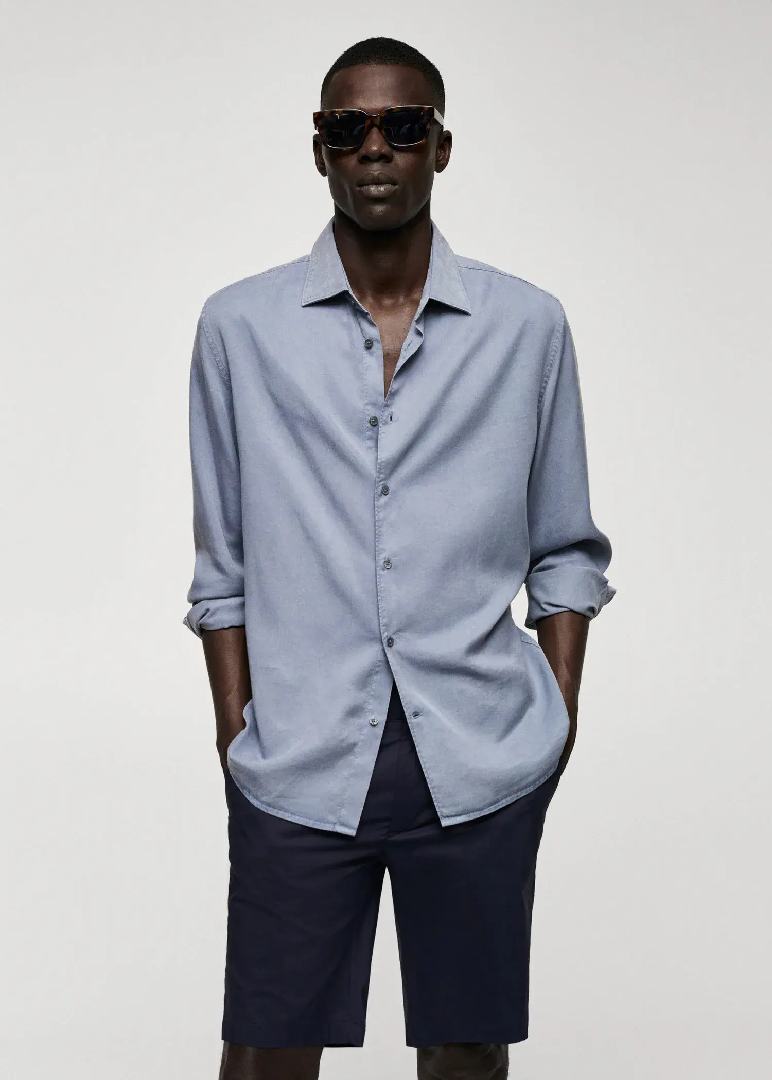 Mango Lyocell fluid shirt. a man wearing a light blue dress shirt. 