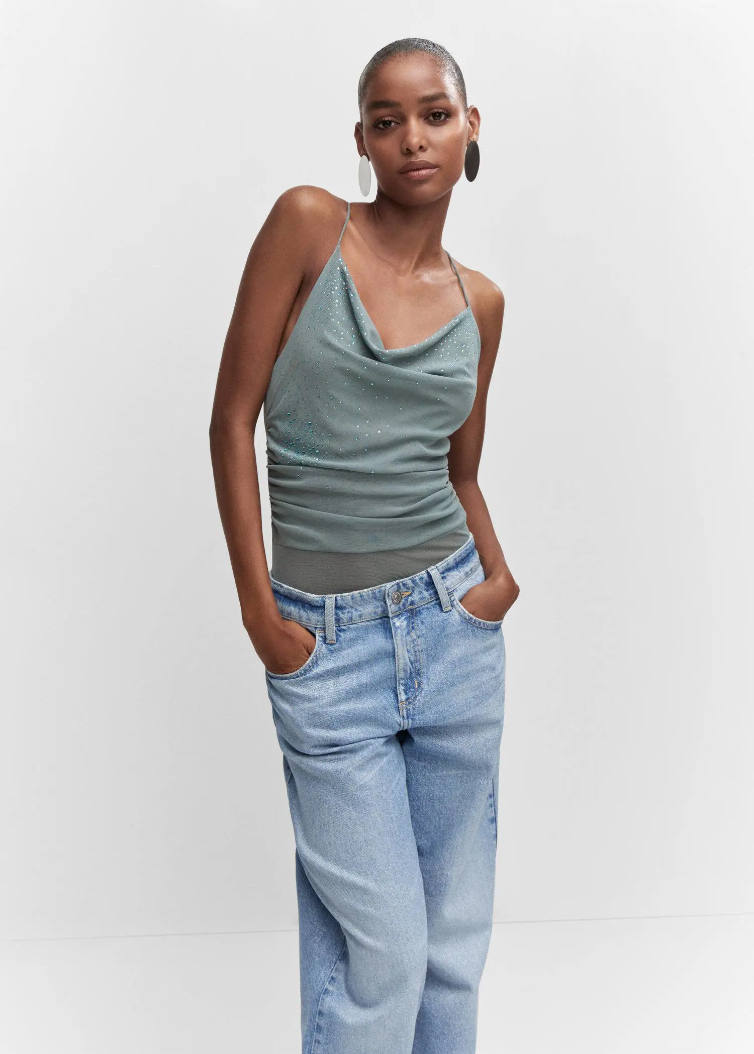 Mango Draped body with rhinestone detail. a woman wearing jeans and a tank top. 