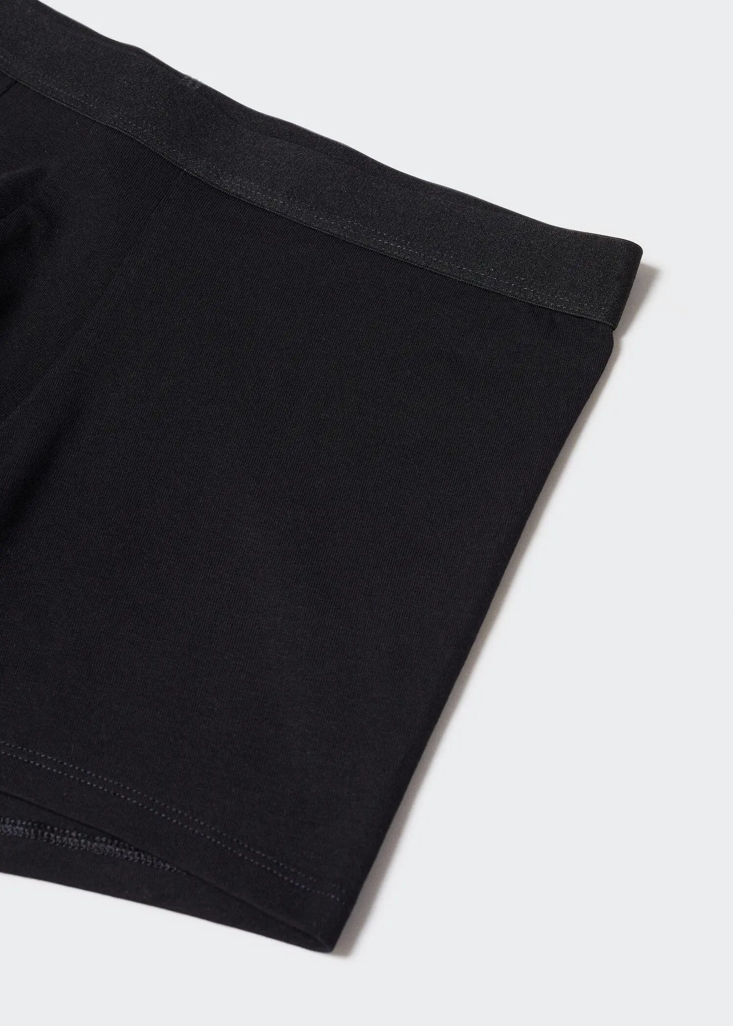 Mango 3-pack of black cotton boxer shorts. a close-up view of a pair of black shorts. 