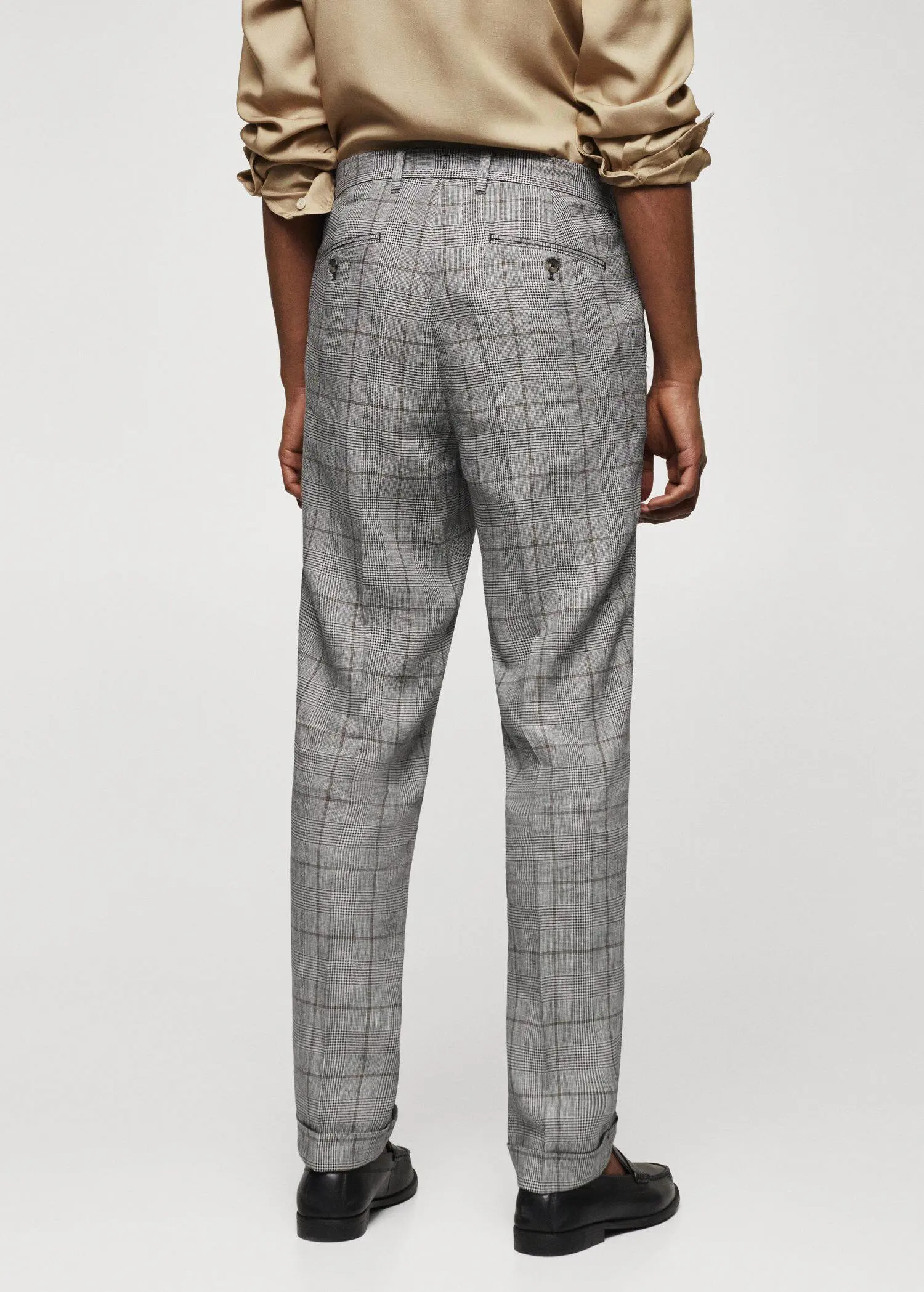 Mango Prince of Wales linen-blend trousers. a person wearing a suit and tie. 