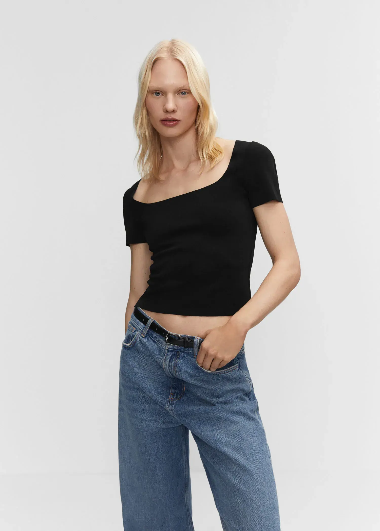 Mango Square neck t-shirt. a woman wearing a black top and jeans. 