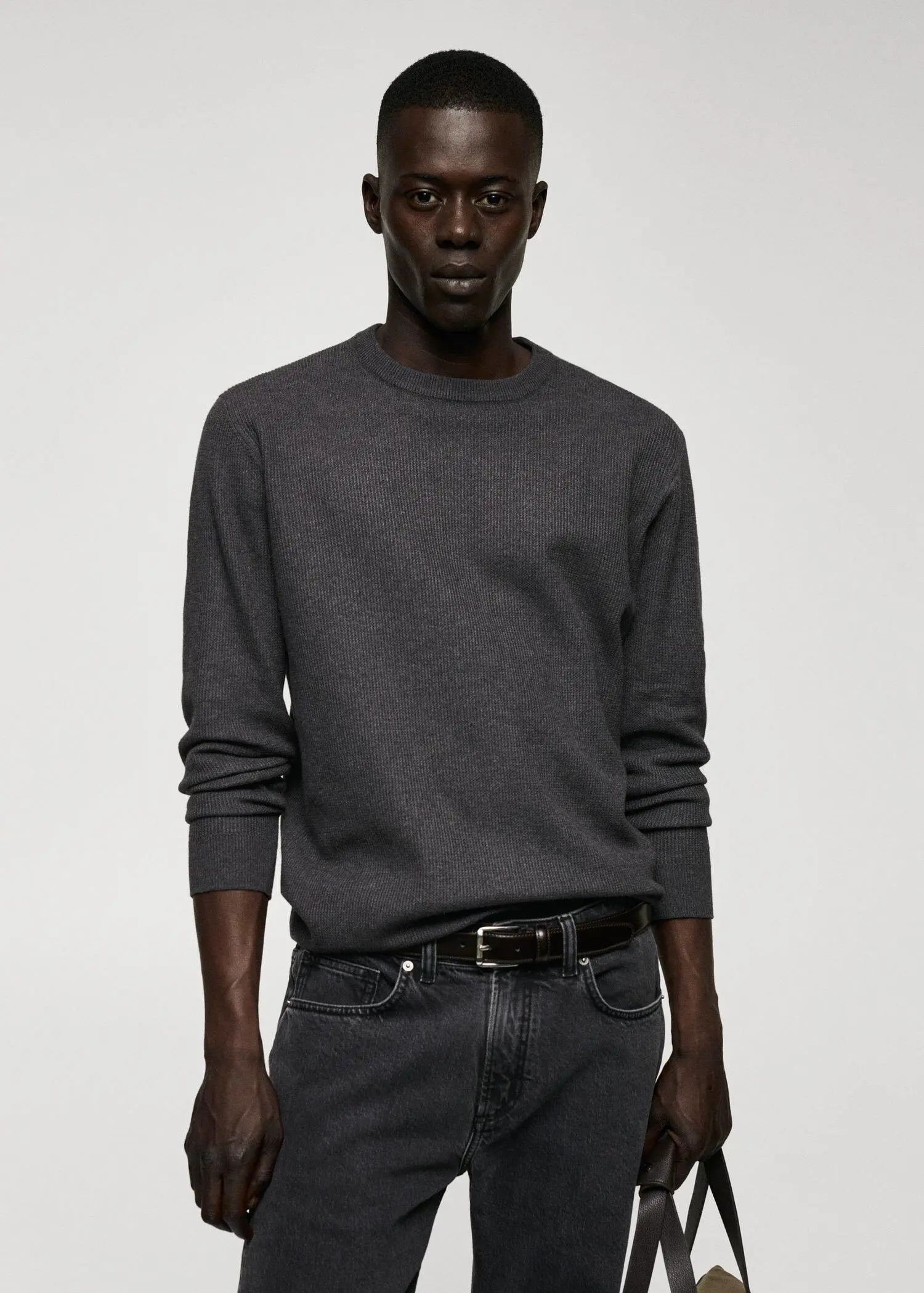 Mango Structured cotton sweater. a man in a gray shirt and black jeans. 
