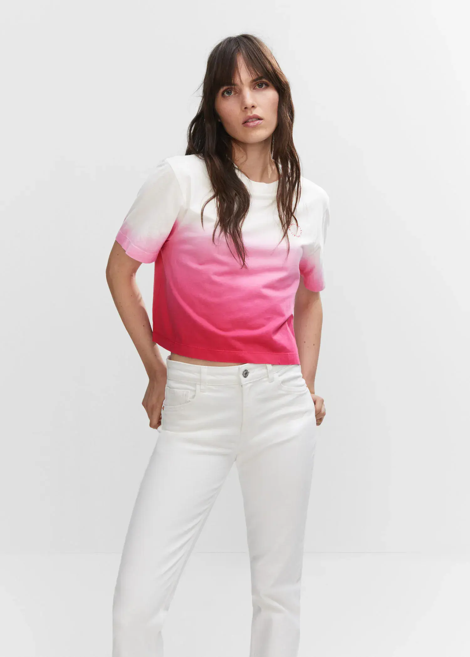 Mango Cotton ombré t-shirt. a woman wearing white pants and a pink top. 
