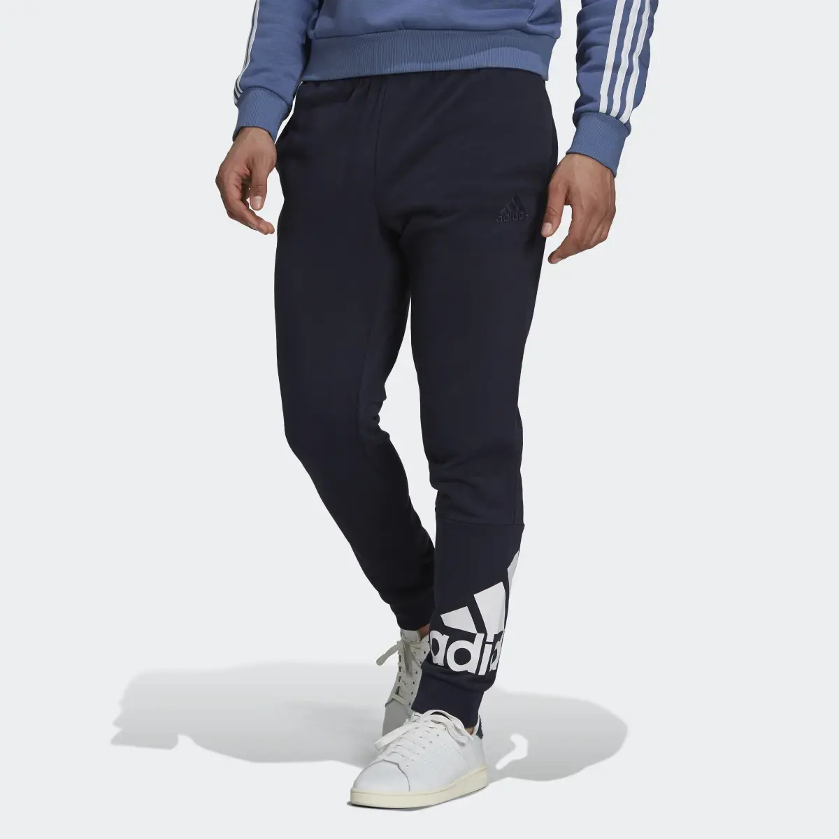 Adidas Essentials French Terry Tapered Cuff Logo Pants. 1