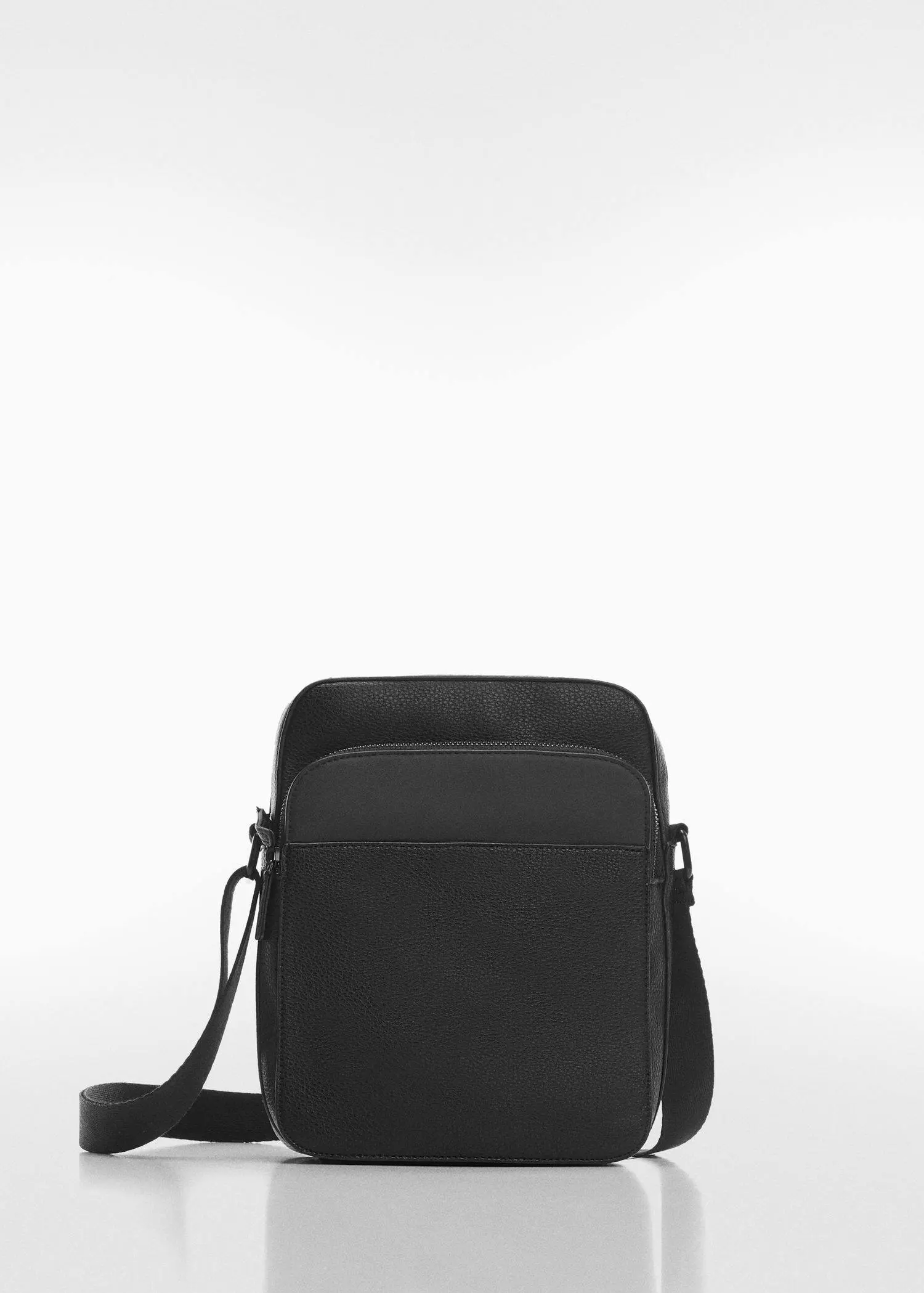 Mango Leather-effect shoulder bag. a black bag is sitting on the ground. 