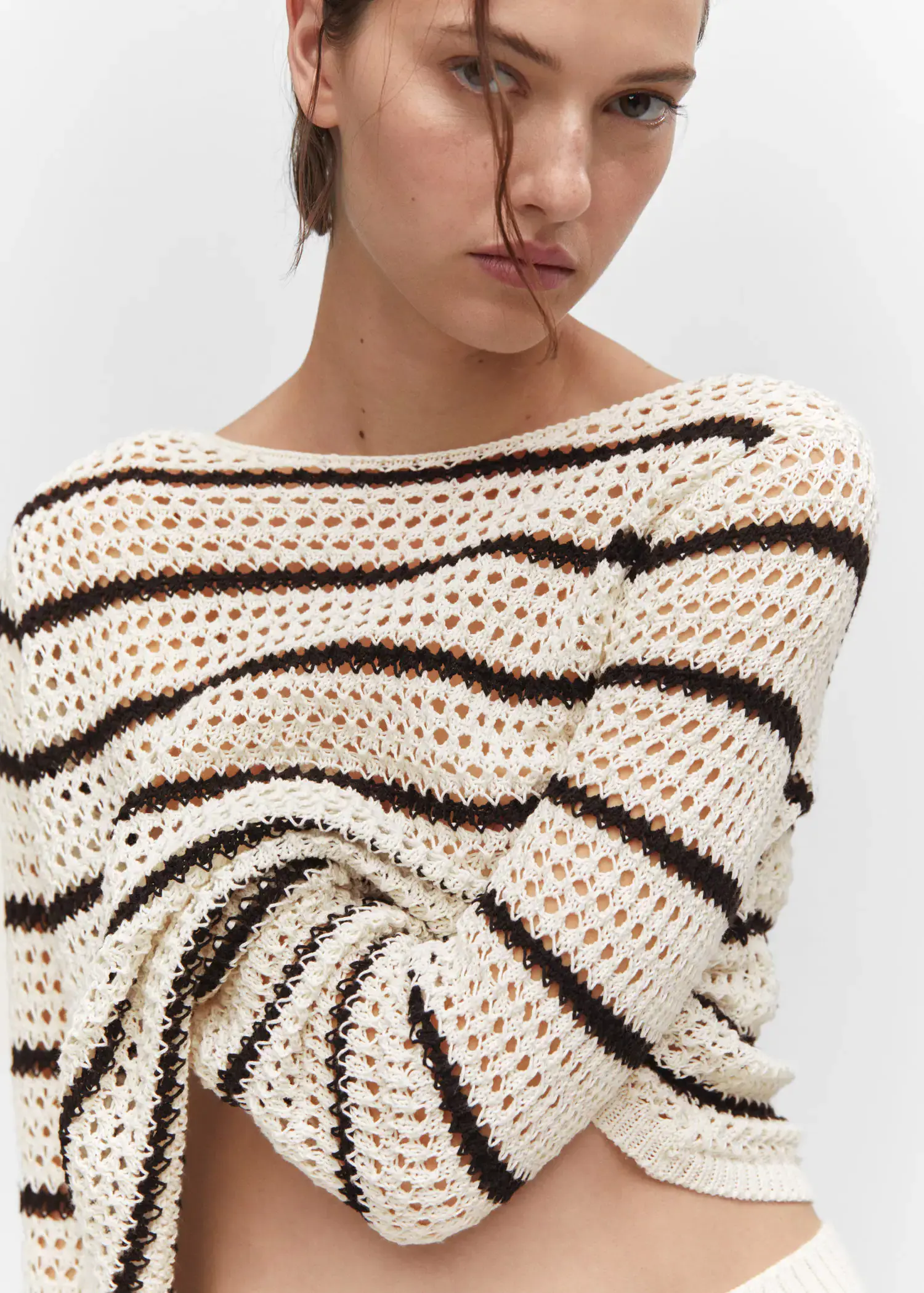 Mango Striped openwork knit sweater. a close up of a person wearing a sweater. 