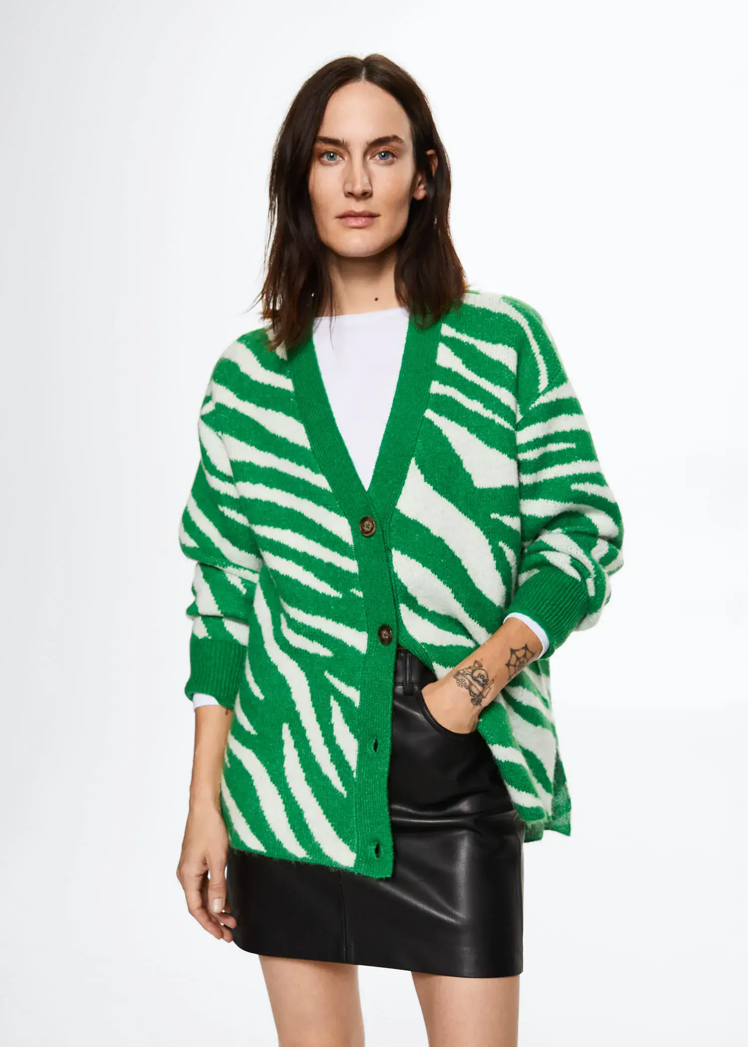 Mango Animal print cardigan. a woman wearing a green and white zebra print sweater. 