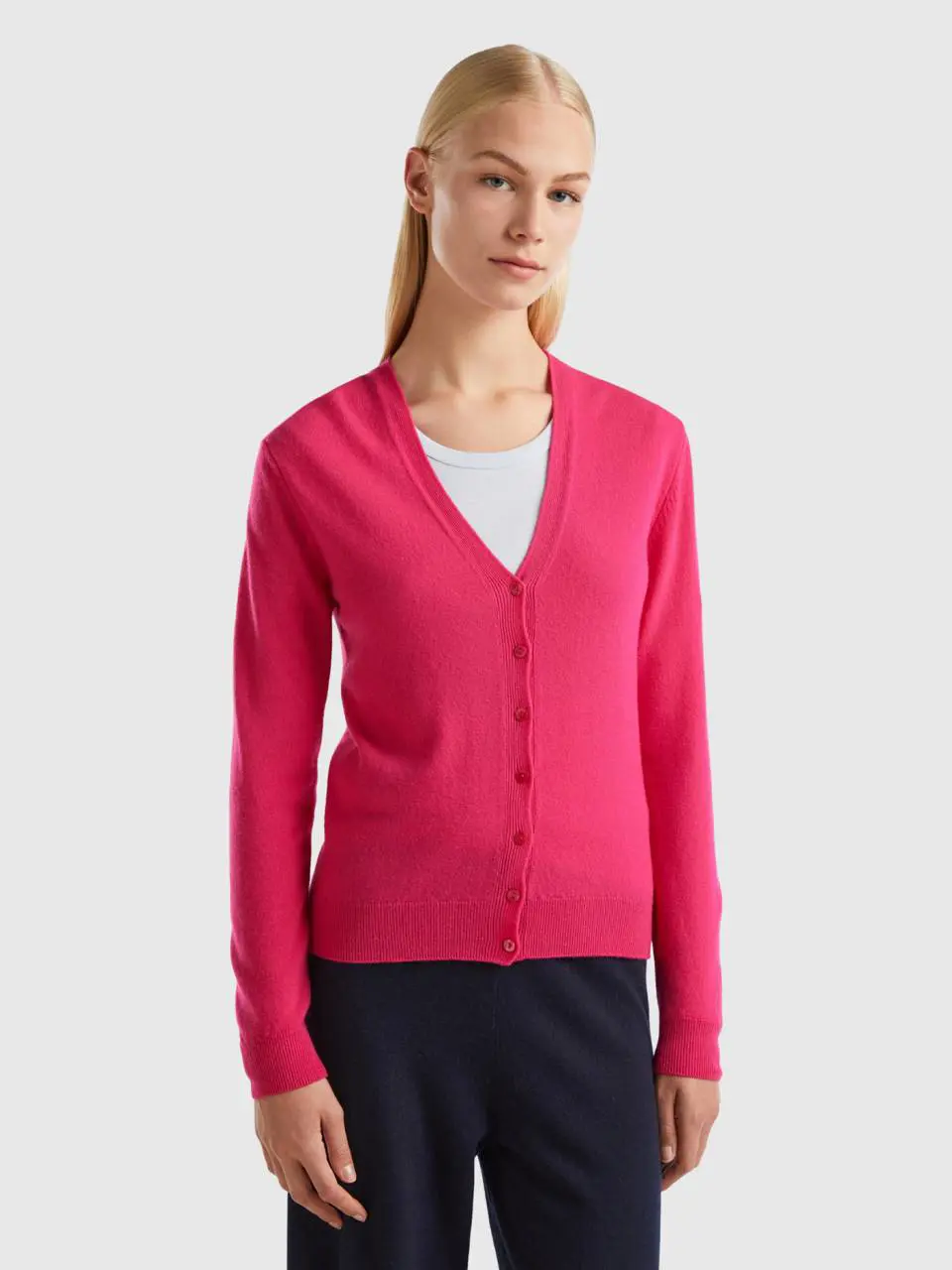 Benetton fuchsia v-neck cardigan in pure merino wool. 1