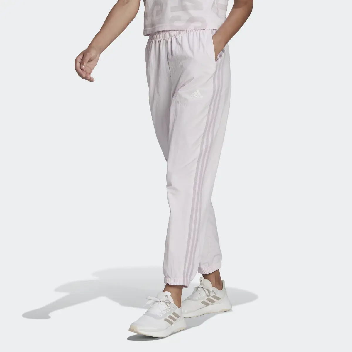 Adidas Pantalon 7/8 en toile Essentials 3-Stripes. 1