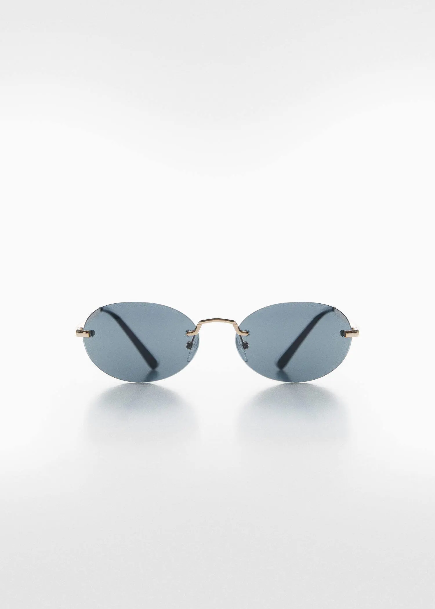 Mango Oval sunglasses. a close up of a pair of glasses on a white surface 