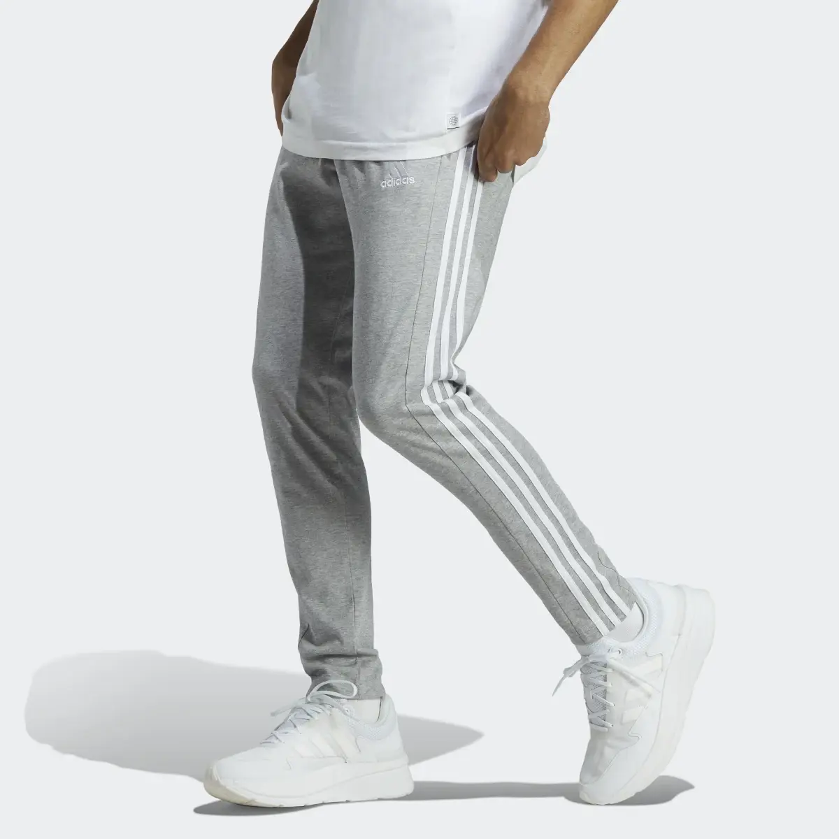 Adidas Essentials Single Jersey Tapered Open Hem 3-Stripes Pants. 1