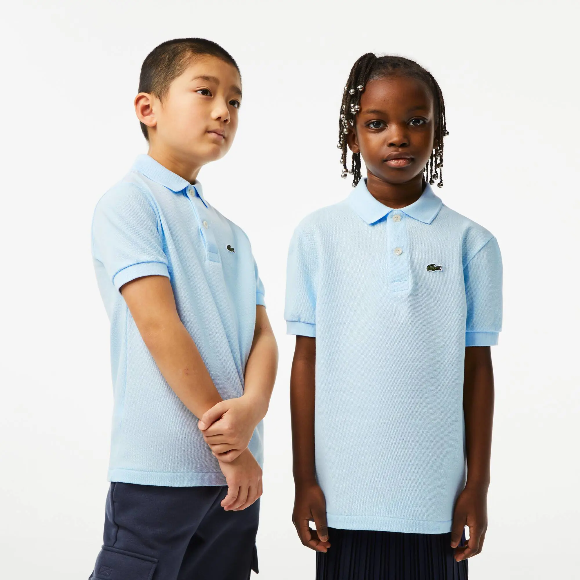 Lacoste Kids' Regular Fit Petit Piqué Polo. 1