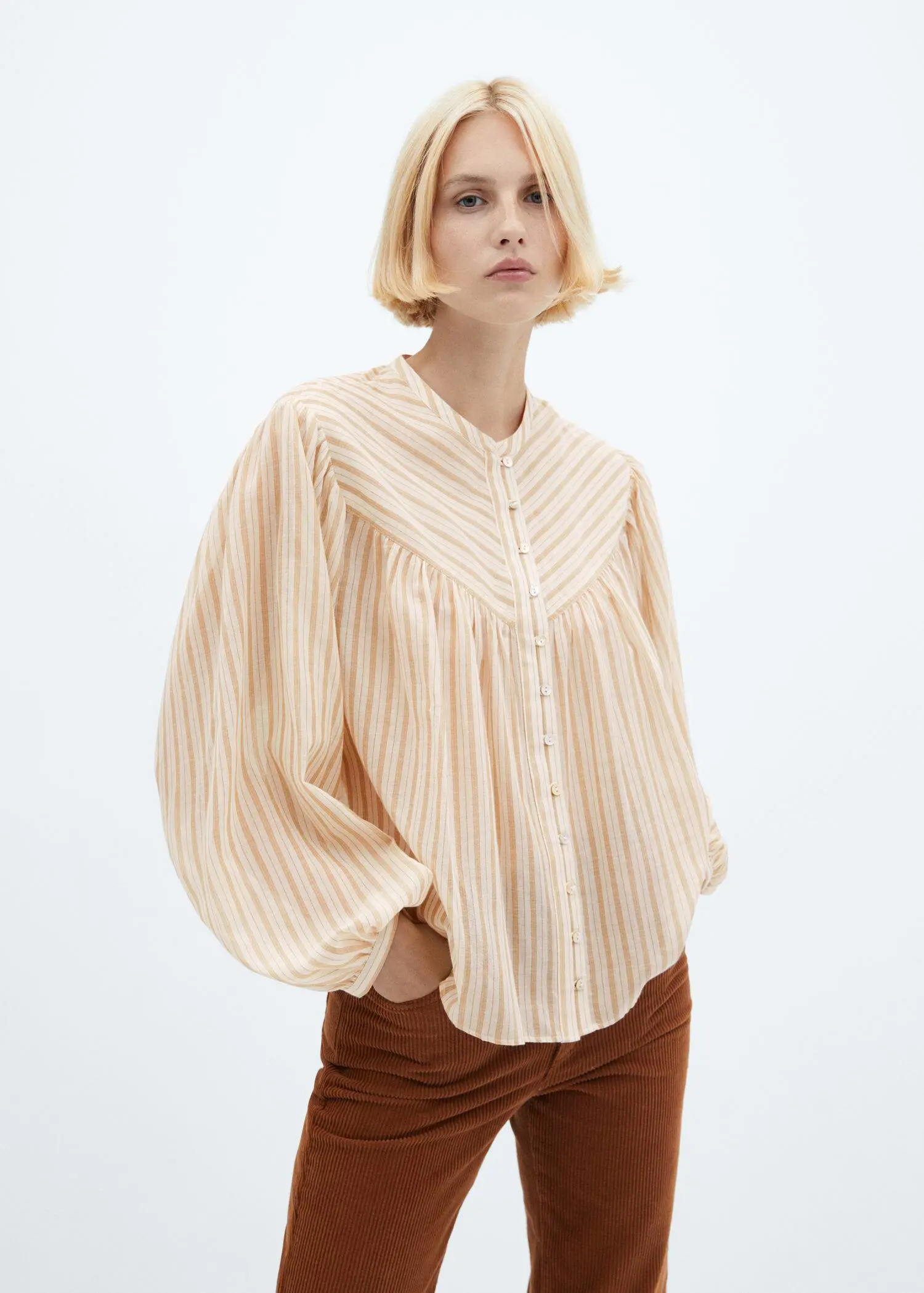 Mango Blouse with puffed sleeves and buttons . 1