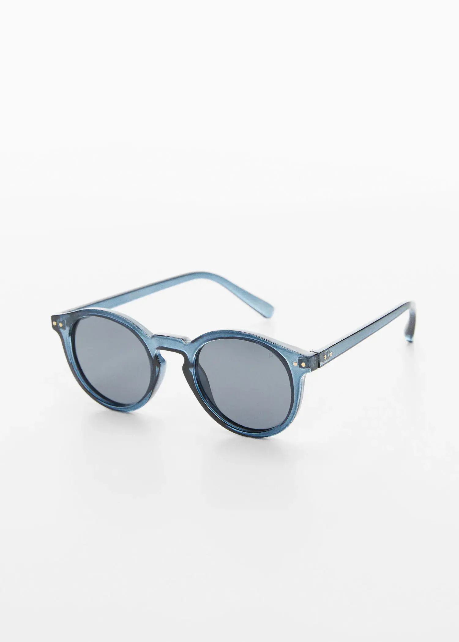 Mango Polarized sunglasses. a pair of sunglasses sitting on top of a white table. 