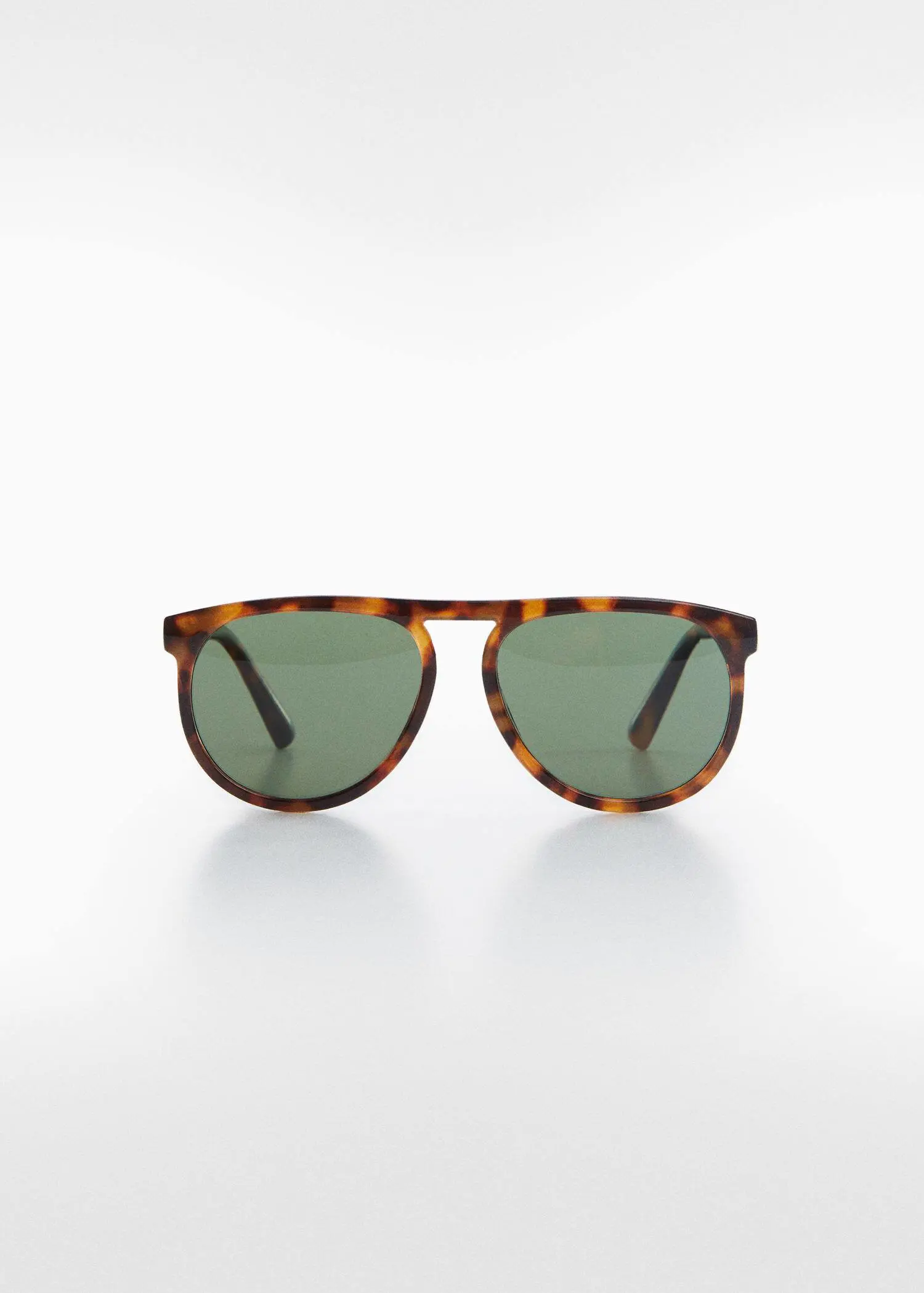Mango Polarised sunglasses. a pair of sunglasses on top of a white surface. 