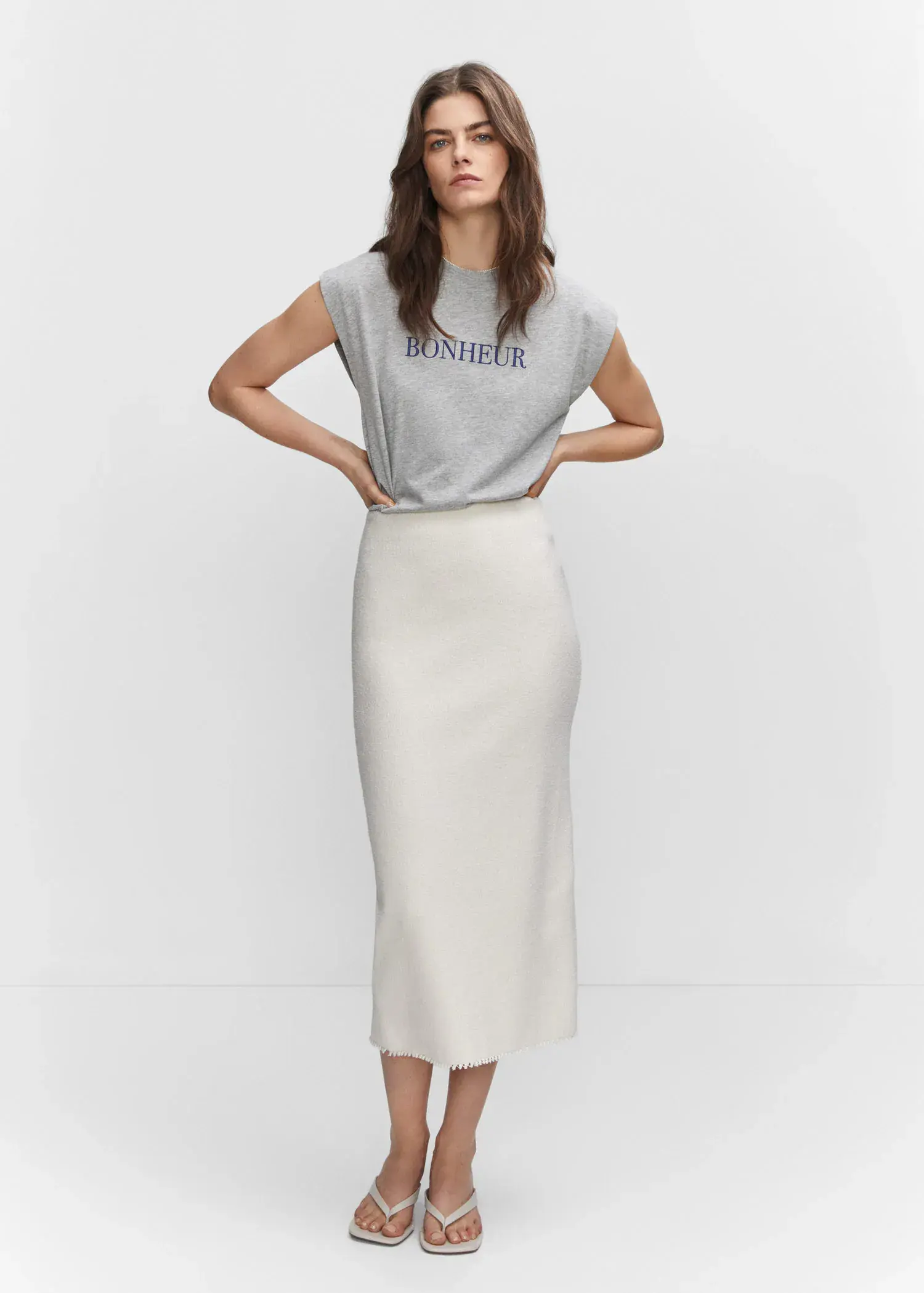 Mango Message cotton T-shirt. a woman wearing a white skirt and a gray shirt. 
