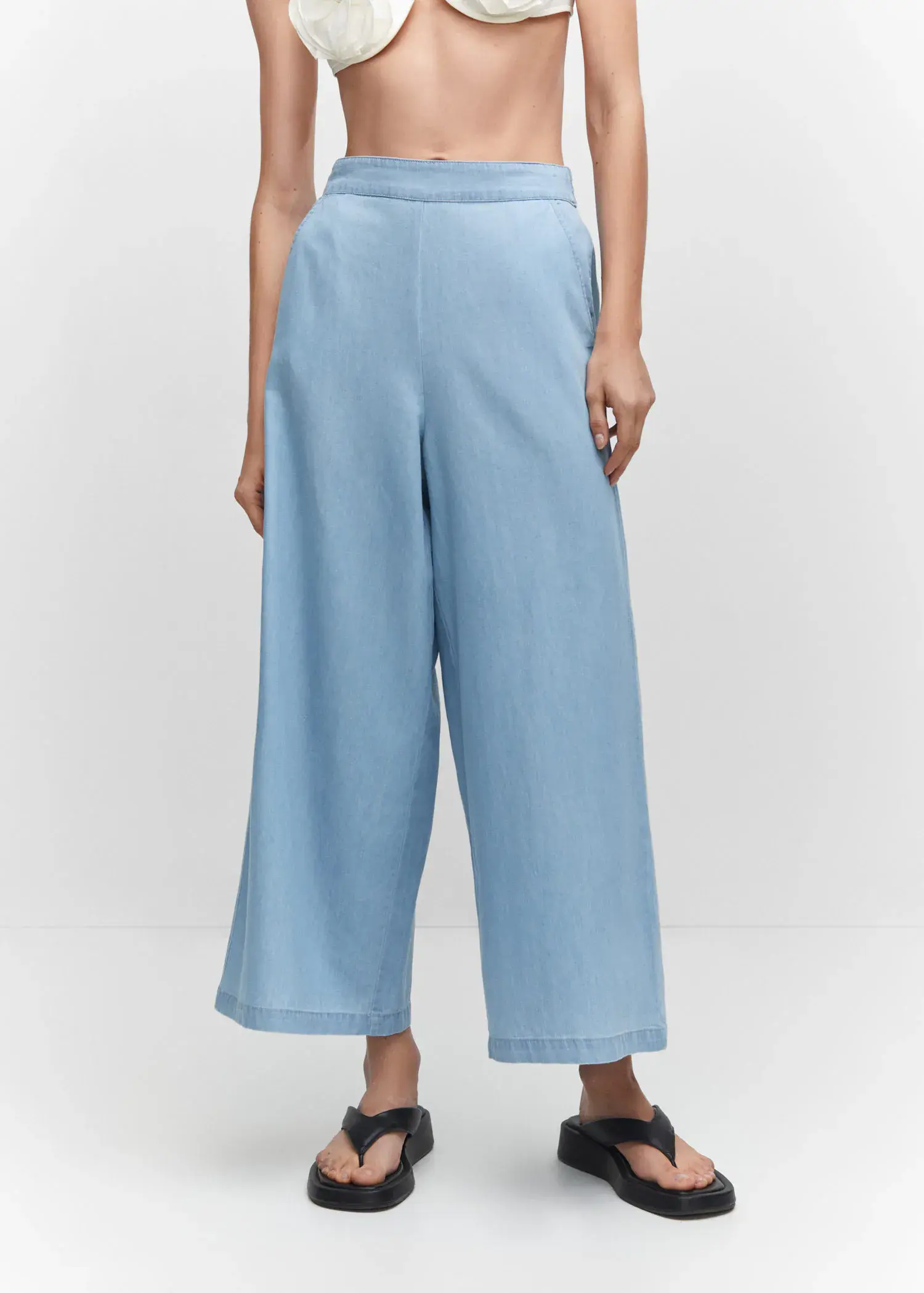 Mango 100% cotton culotte trousers . a person standing wearing a pair of light blue pants. 