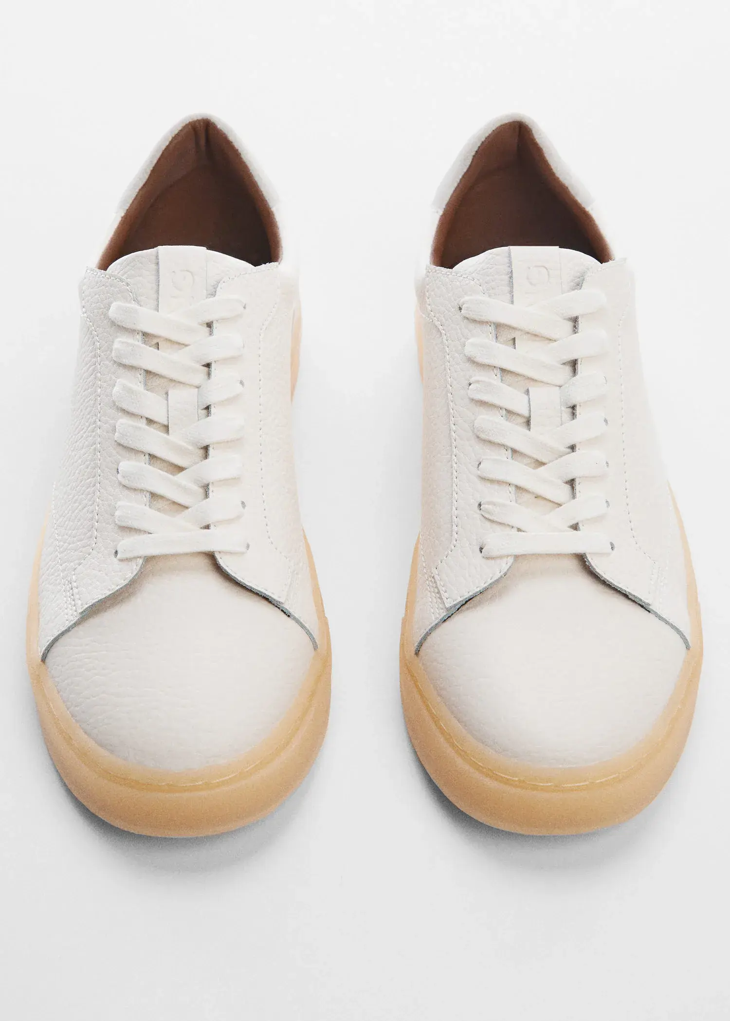 Mango Nappa leather trainers. a pair of white sneakers with a wooden bottom. 
